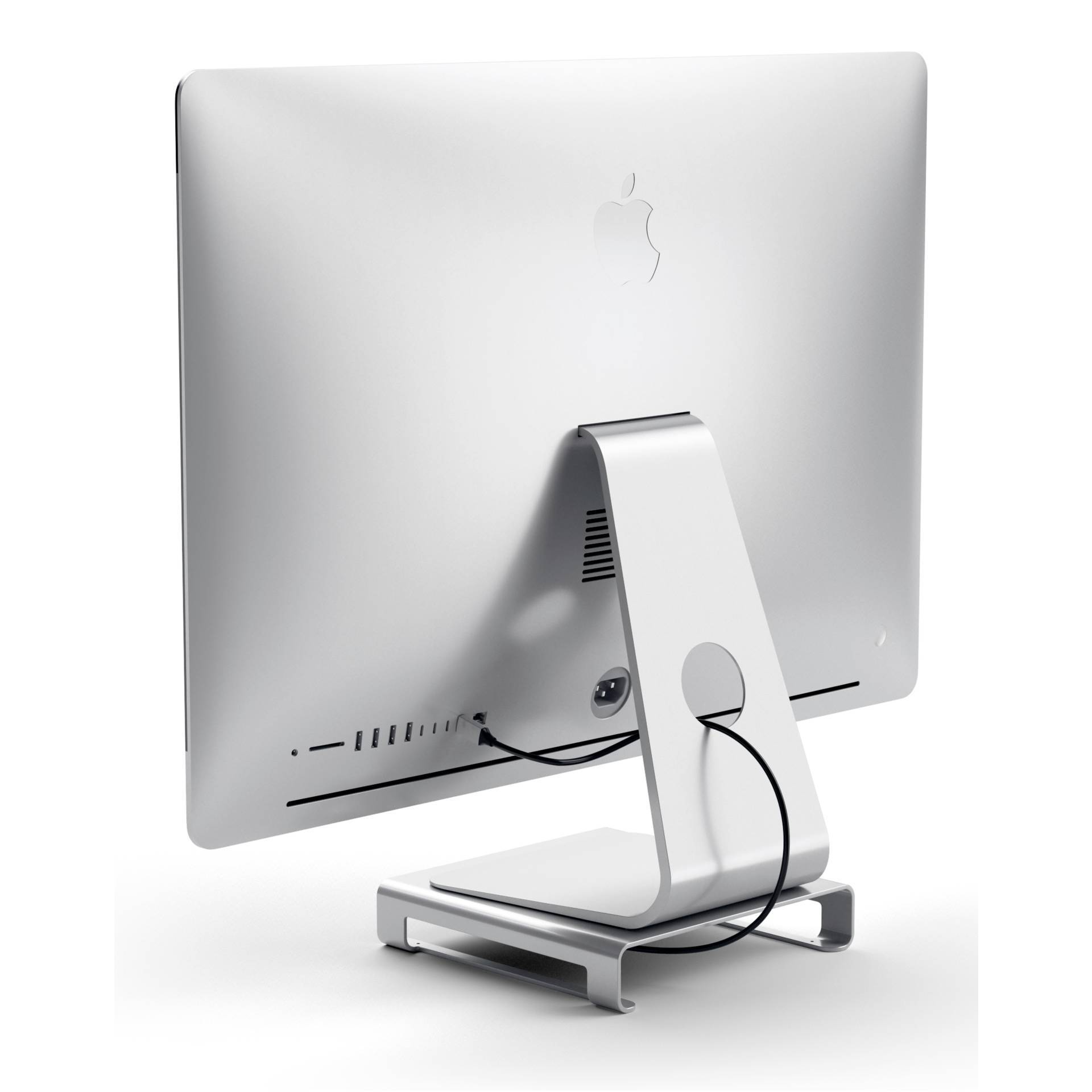 Strieborný počítač iMac z pohľadu zozadu, umiestnený na stojane. Káble prechádzajú otvorom v stojane.