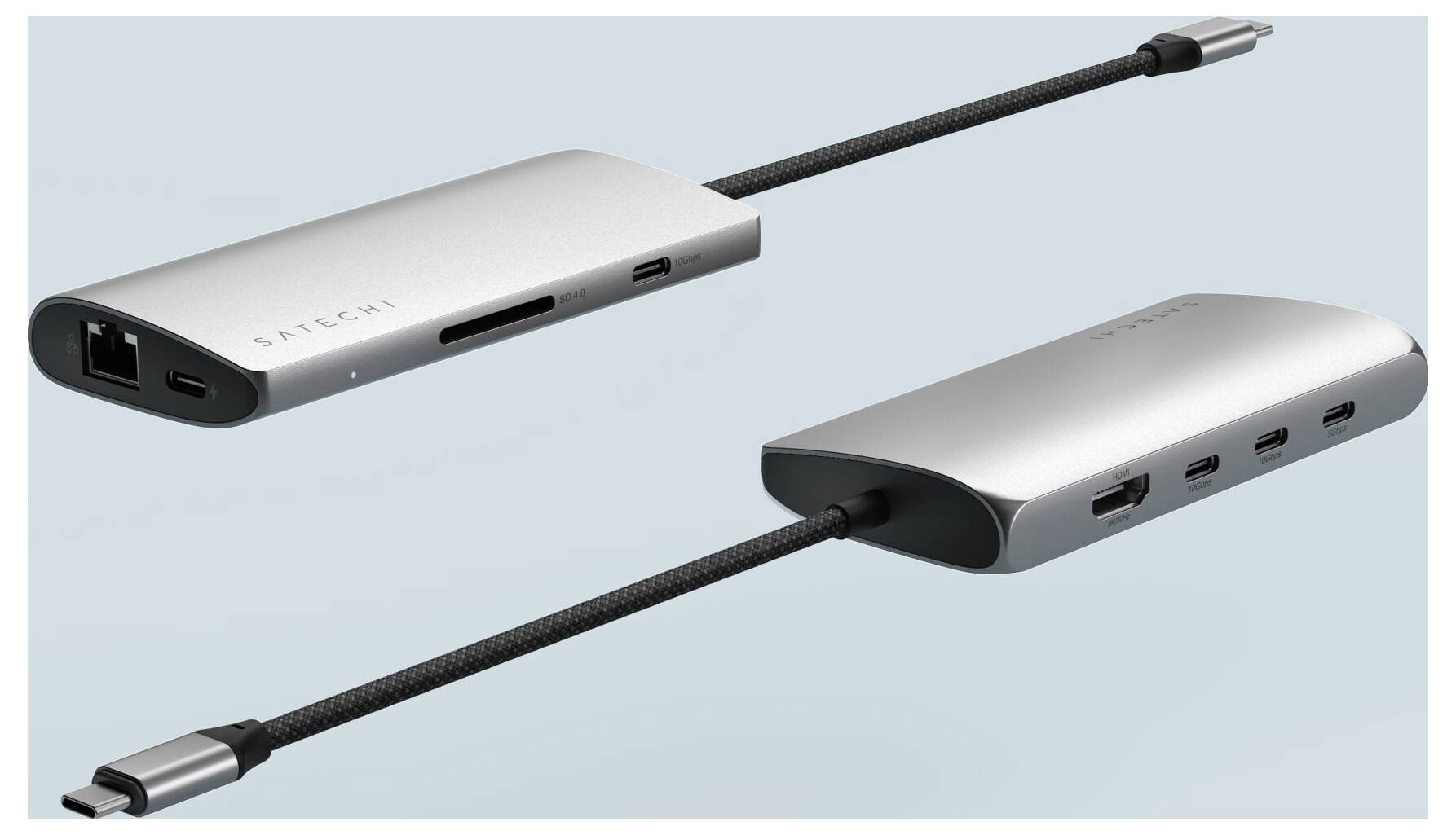 Strieborný USB-C hub s viacerými portami vrátane ethernetového, USB, HDMI a čítačky SD kariet je zobrazený z dvoch perspektív.