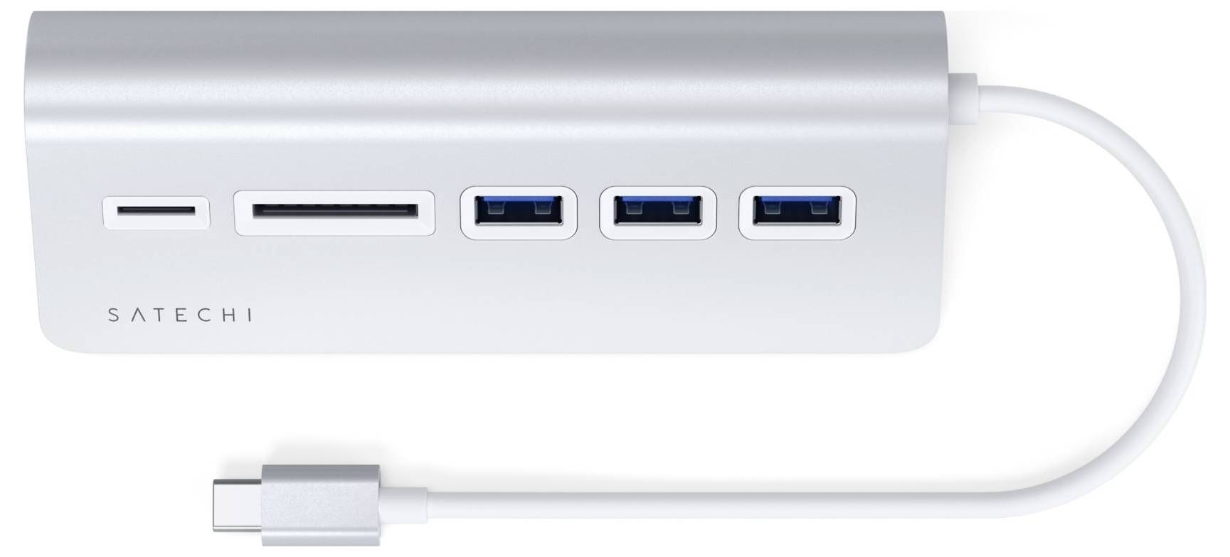 Strieborný USB hub s viacerými portami: dva USB-A, jeden USB-C a dva sloty pre čítanie kariet. Slúži na prepojenie zariadení s počítačmi.