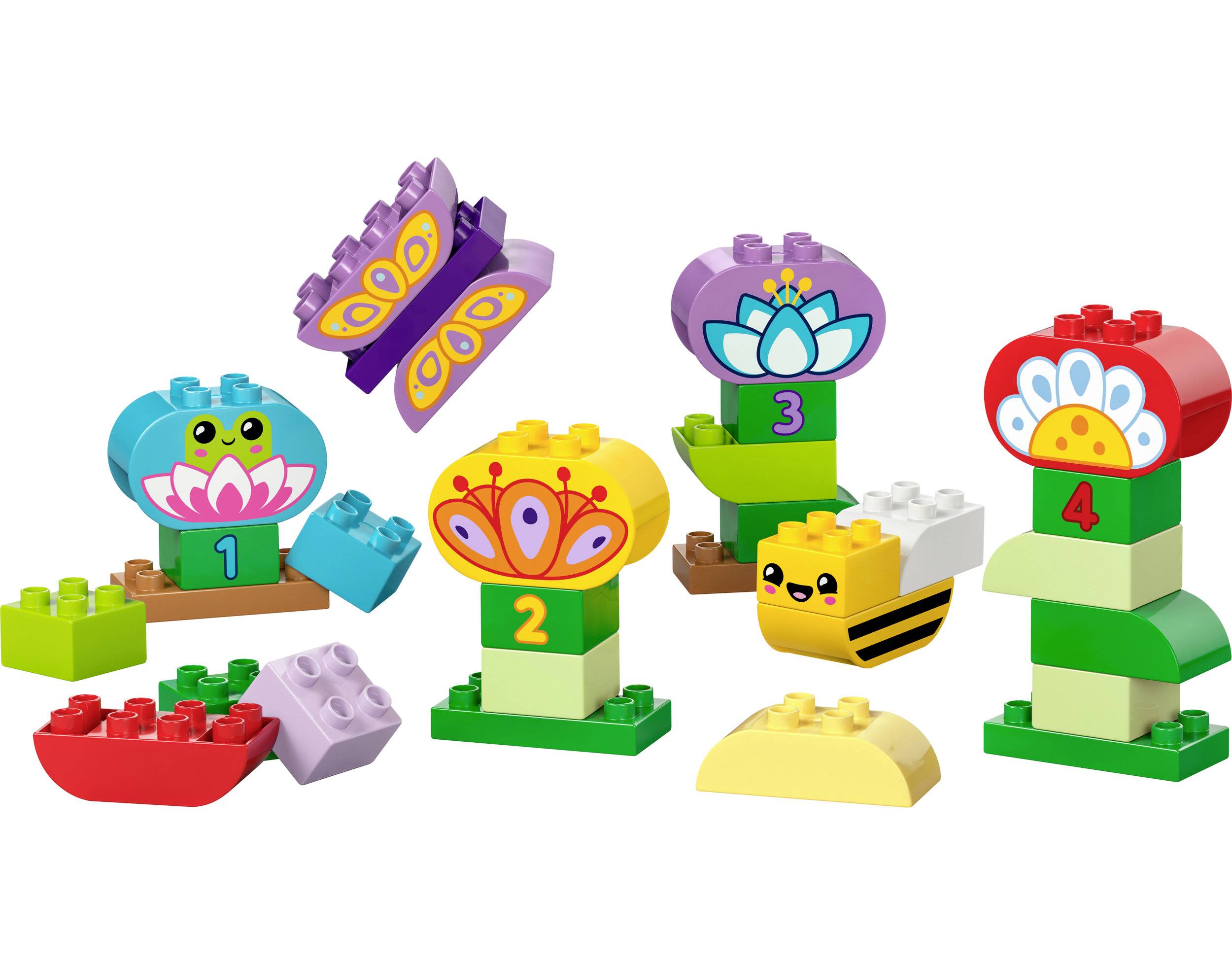 Farebné LEGO-Duplo kocky vytvárajú kvety, motýle a tvár žaby. Každá figúrka je označená číslom od 1 do 4.