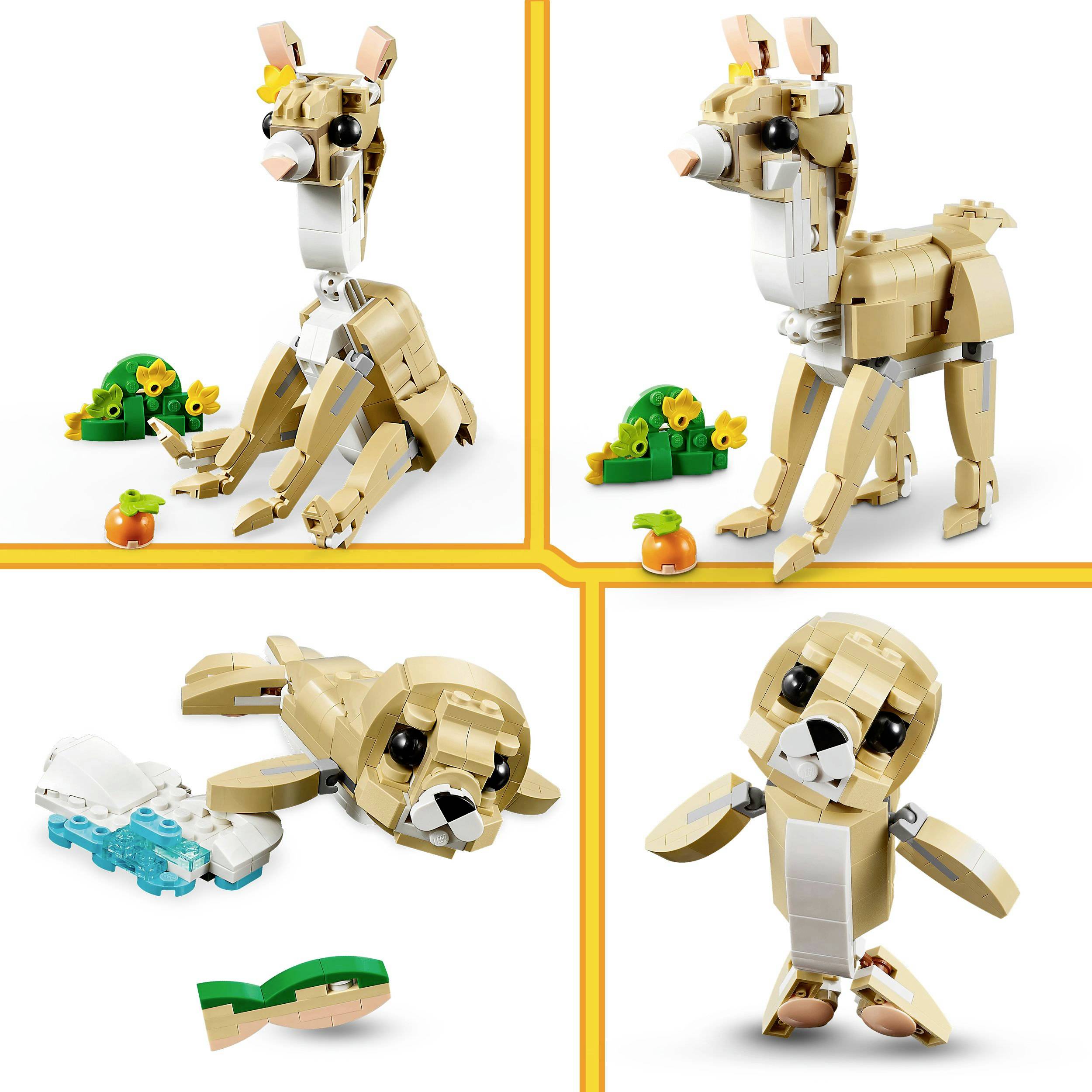 Štyri LEGO figúrky zvierat vrátane mláďaťa srnca, psa a vtáka v rôznych póza obklopené malými rastlinami a hračkami.
