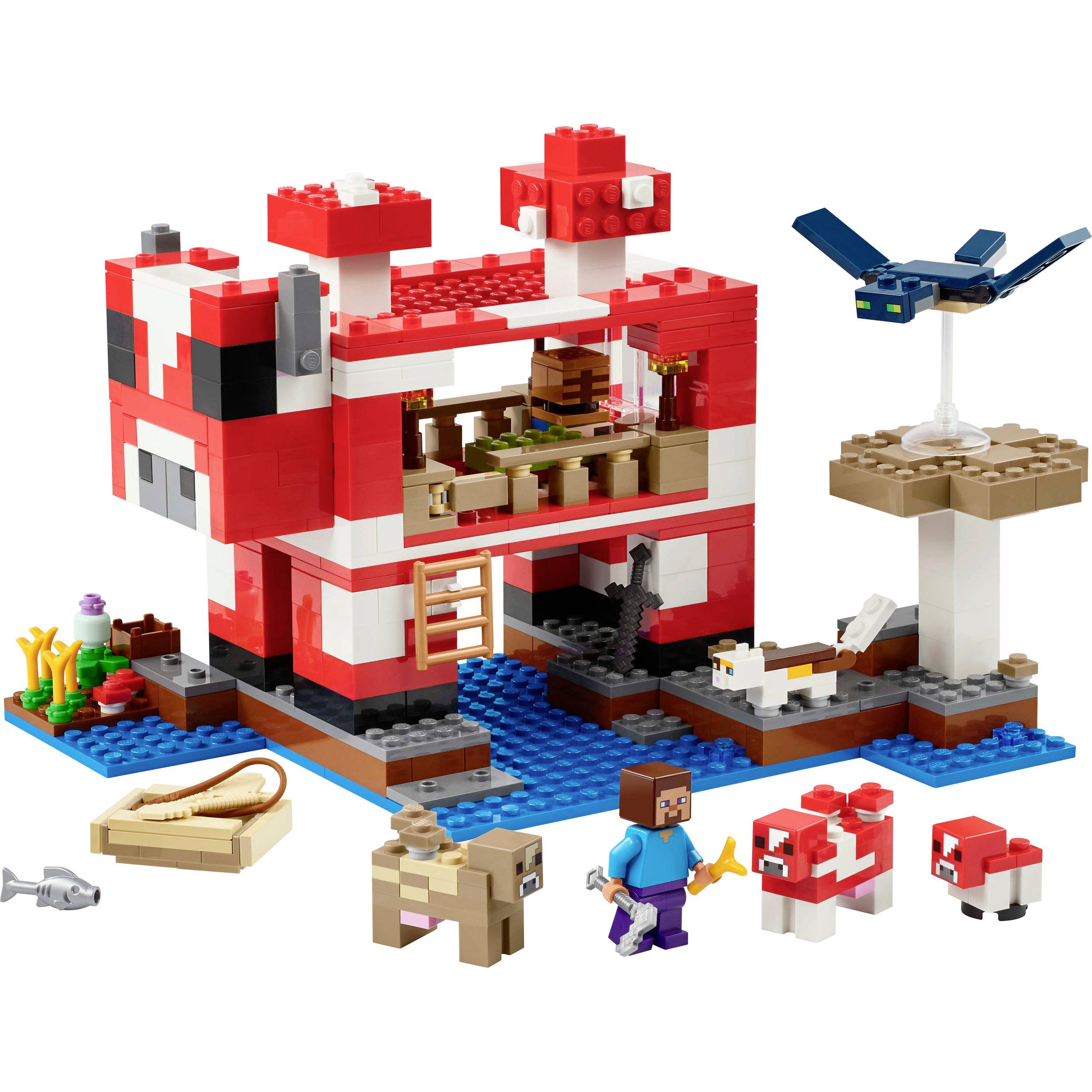 LEGO Minecraft súprava s červenou budovou, figúrkami a zvieratami ako pes a ovca. Obsahuje modrú rieku, zelený strom a doplnky.
