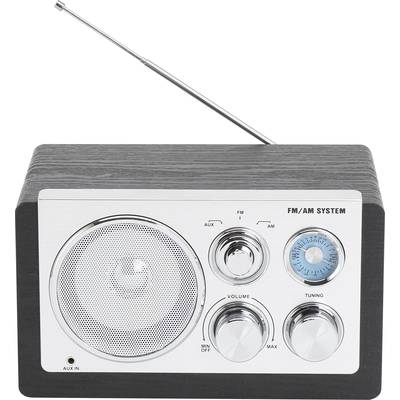 Retro rádio s FM/AM systémom, čiernym krytom a striebornými ovládacími prvkami. Viditeľné sú regulátor hlasitosti a ladiaci gombík.