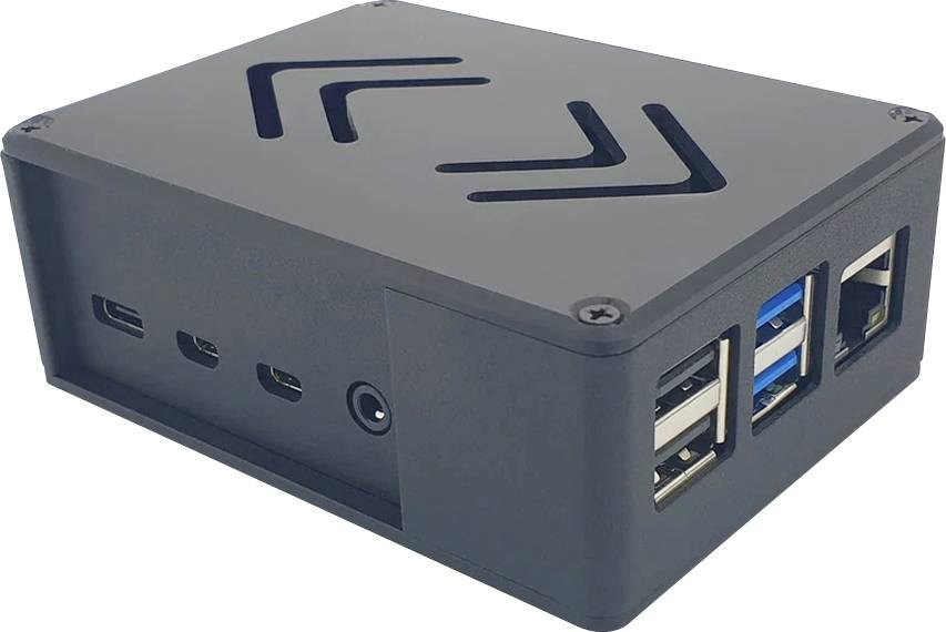 Čierna schránka pre jednodoskový počítač s viacerými USB portami a vetracími otvormi na hornej strane.