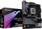Herná základná doska Aorus X670E Aorus Master vedľa pôvodného obalu. Čierna s RGB podsvietením, rozpoznateľná podľa chladičov a konektorov.