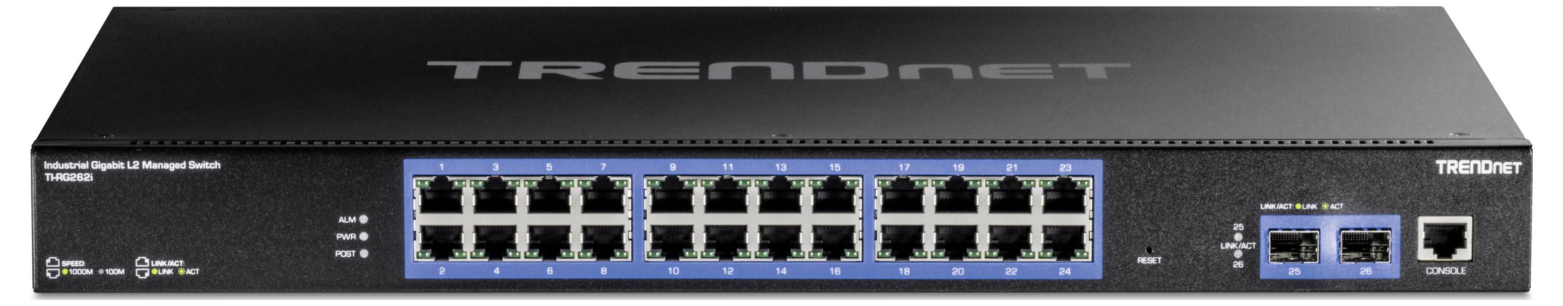 Čierny sieťový switch s 24 ethernetovými portami vpredu. Pod nimi sa nachádzajú stavové LED diódy. Vpravo sú dva dodatočné porty a malý displej.