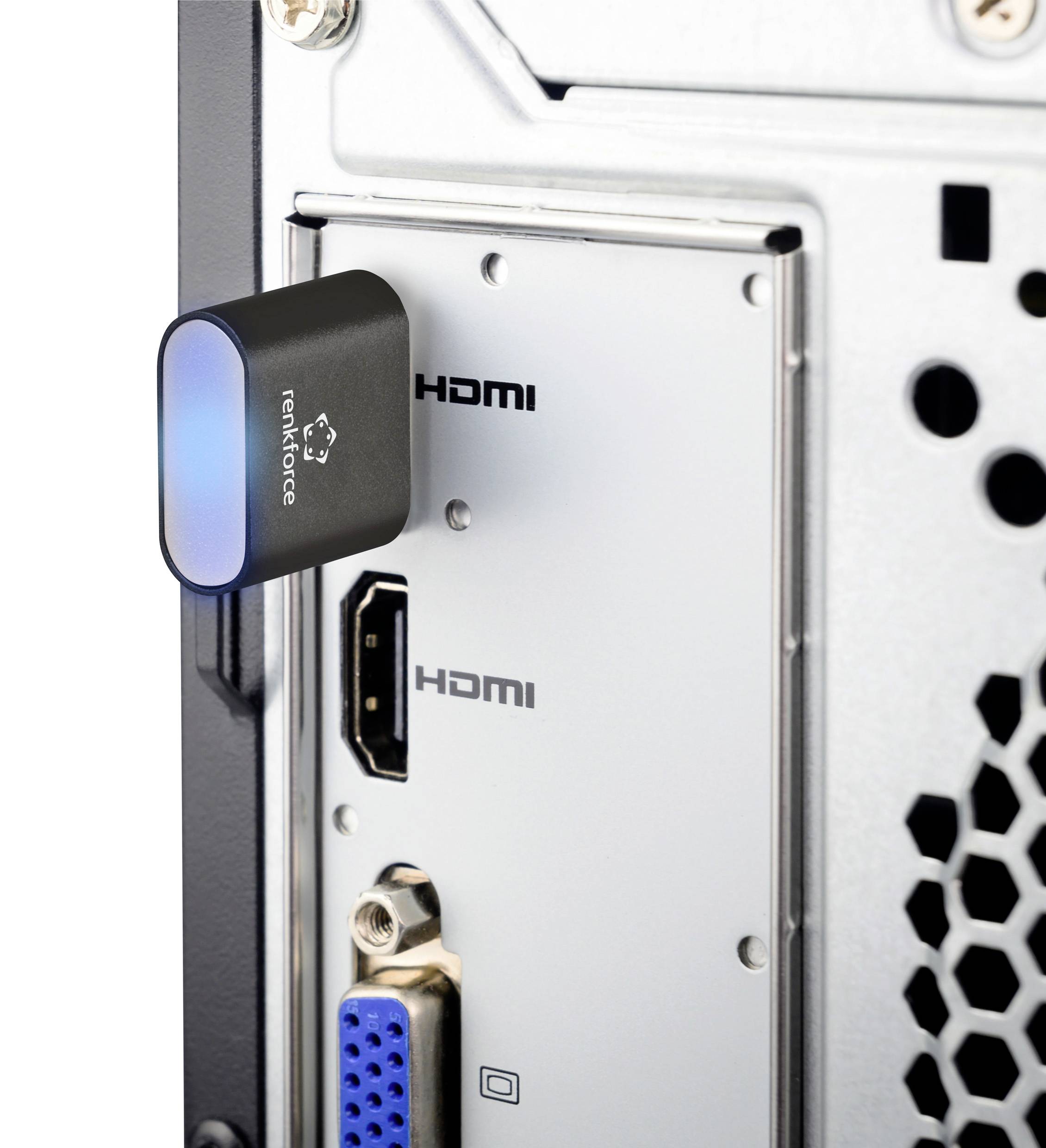 HDMI konektor je zapojený do HDMI zásuvky počítača. Vedľa sa nachádza ďalšia HDMI zásuvka a VGA zásuvka.