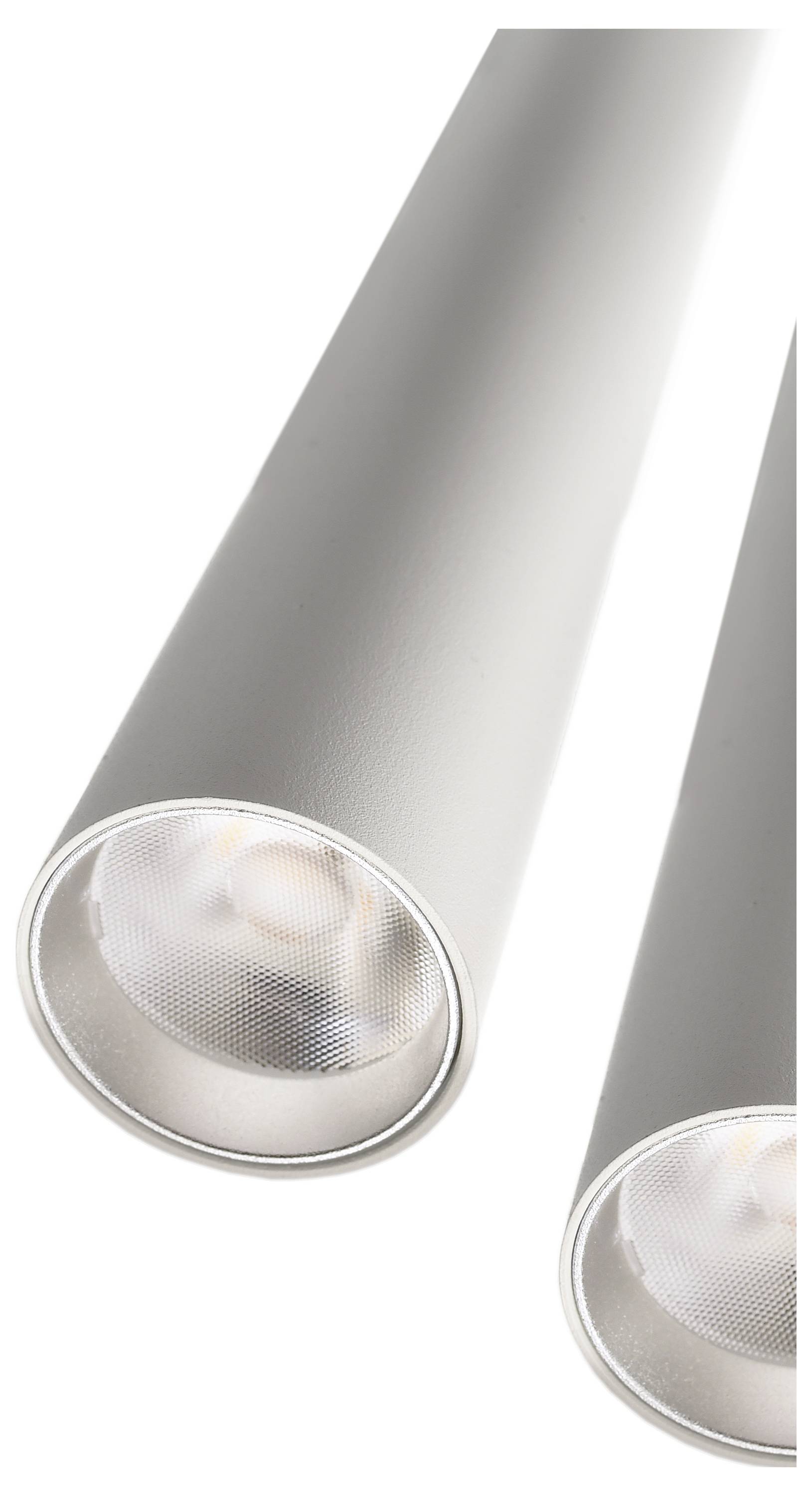 Dve strieborné cylindrické LED svietidlá v modernom dizajne, umiestnené blízko seba, vyžarujú jemné, teplé svetlo.