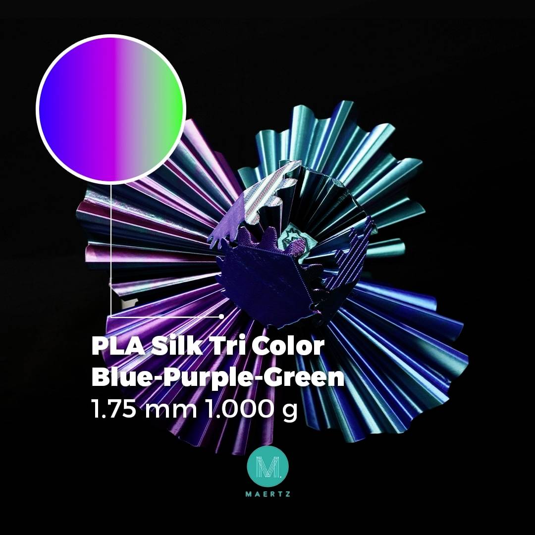 PLA hodváb Tri Color Modrá-Fialová-Zelená 1,75 mm 1.000 g zobrazuje farebný, špirálovo usporiadaný materiál.
