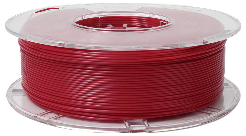 Červená cievka plastového filamentu pre 3D tlačiareň.