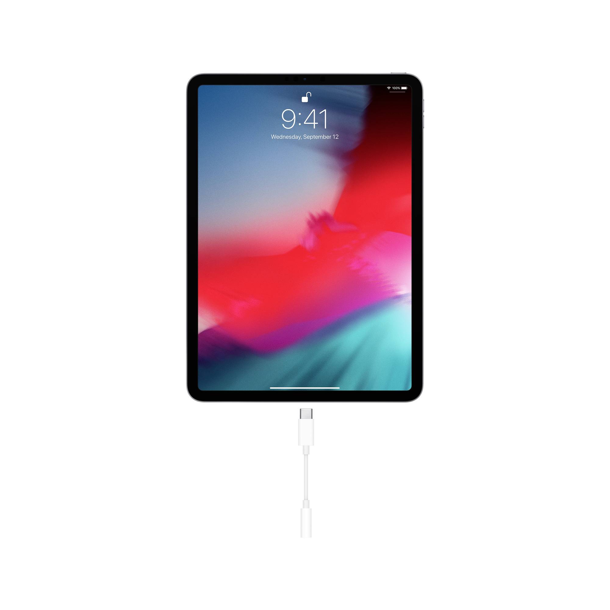 Tablet s jasným displejom a dátumom 'Streda, 12. september', pripojený k nabíjaciemu káblu.