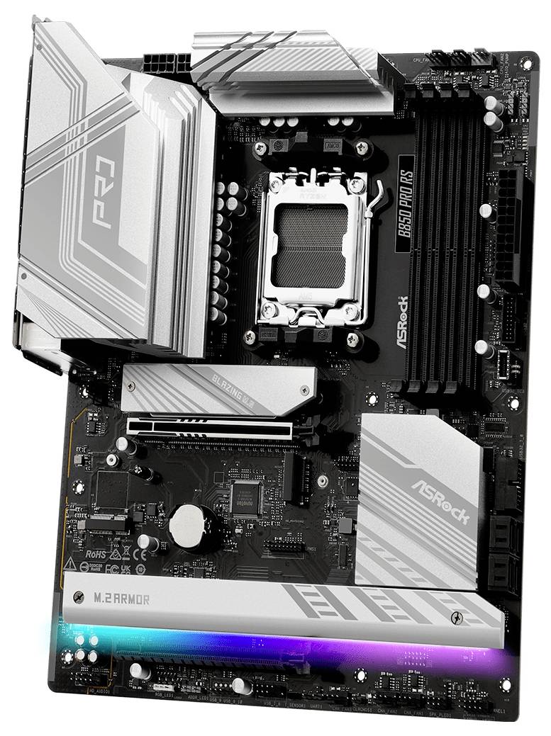 Strieborná a čierna počítačová základná doska s RGB podsvietením, označená nápisom "ASRock" a "M.2 Armor", zobrazuje komplexné elektrické obvody.