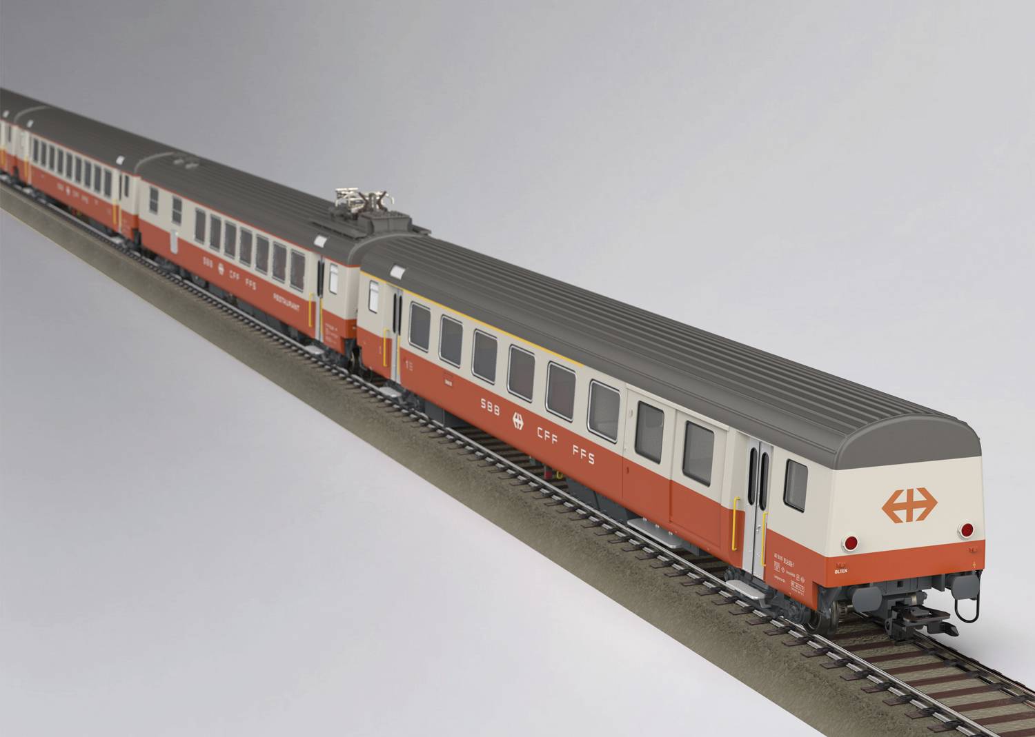 Model vlaku vo farbe a dizajne Švajčiarskych spolkových železníc v červeno-bielych farbách na železničnej trati.