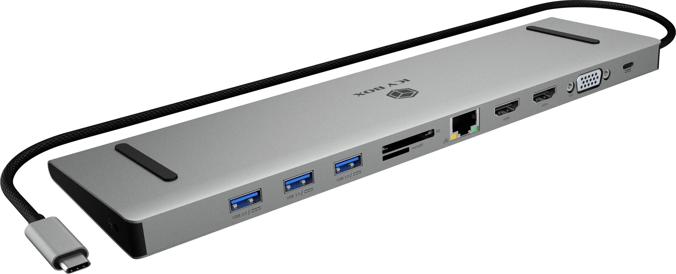 USB-C dokovacia stanica s viacerými portami: tri USB porty, dva HDMI, VGA, Ethernet a čítačka kariet. Káble pripojené na boku.