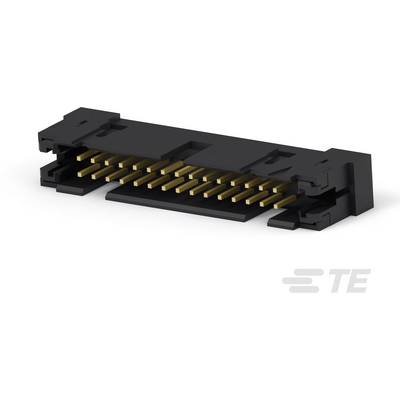 Čierny konektor pre elektronické komponenty so zlatými kovovými kontaktmi, ležiaci na hladkom povrchu.