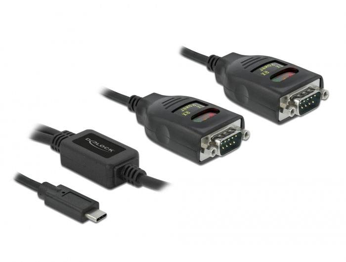 'Dva čierne adaptéry s RS-232 portmi a USB-C káblom. Značka: DeLock. Prepája sériové zariadenia s hardvérom kompatibilným s USB-C.'
