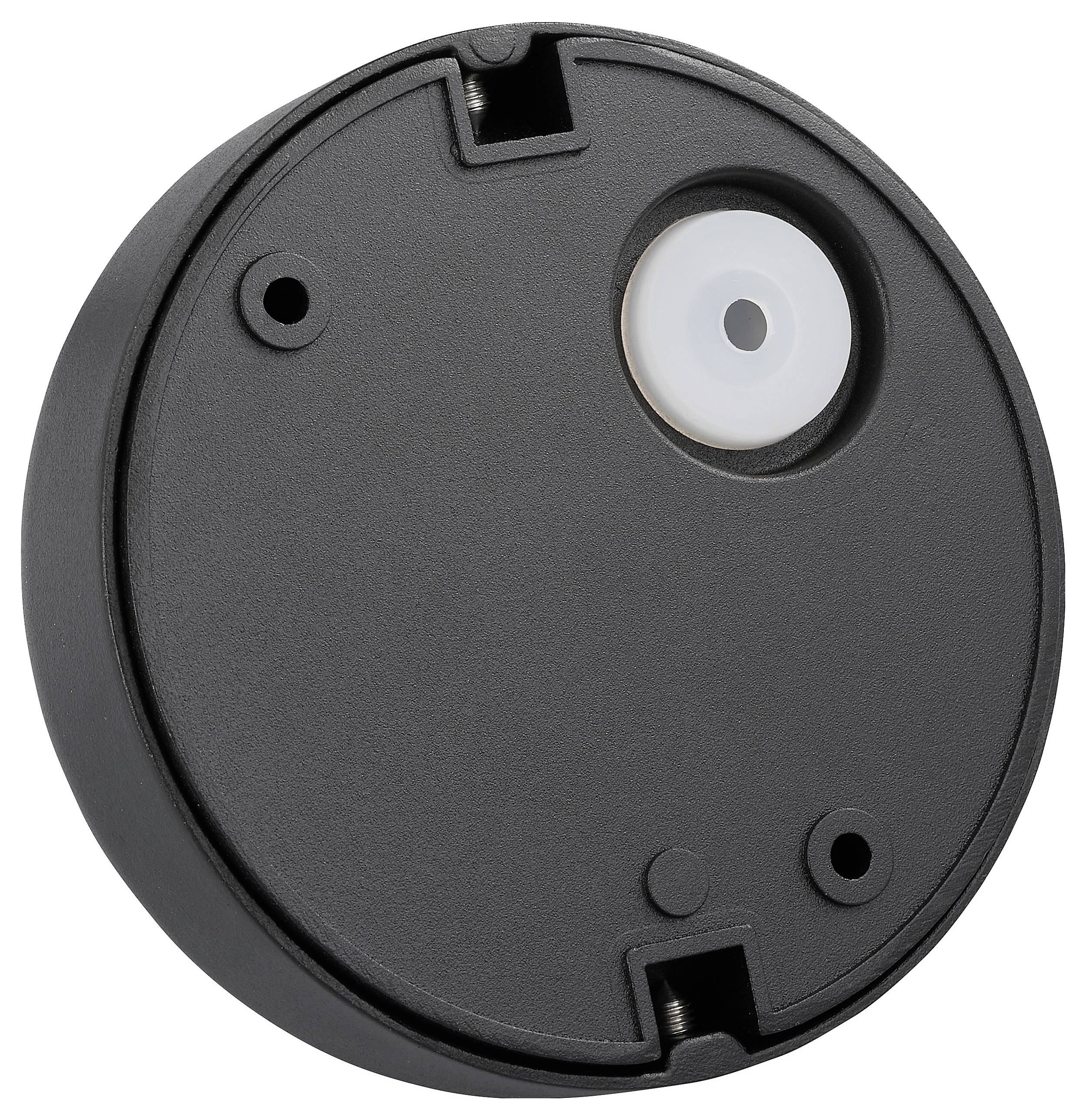 Okrúhla čierna plastová základňa s kruhovým bielym senzorom alebo tlačidlom na vrchu. Má dva montážne otvory a výrez na bočnej strane.