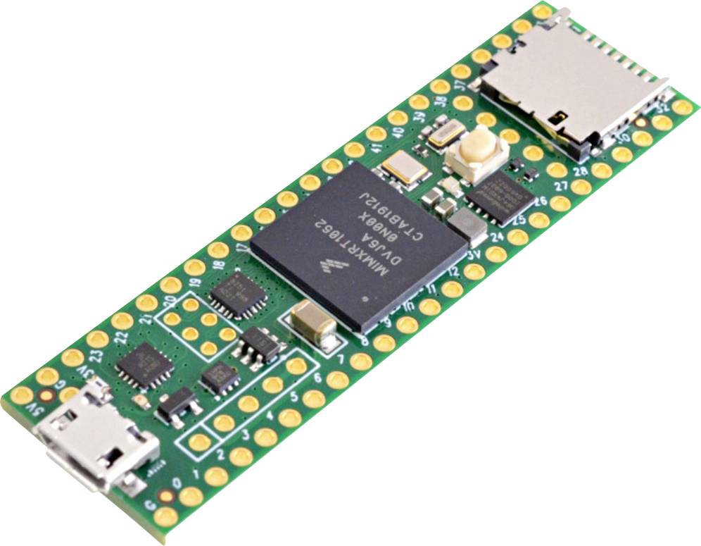 Zelená mikroprocesorová doska s viacerými čipmi, USB portami a malým tlačidlom.