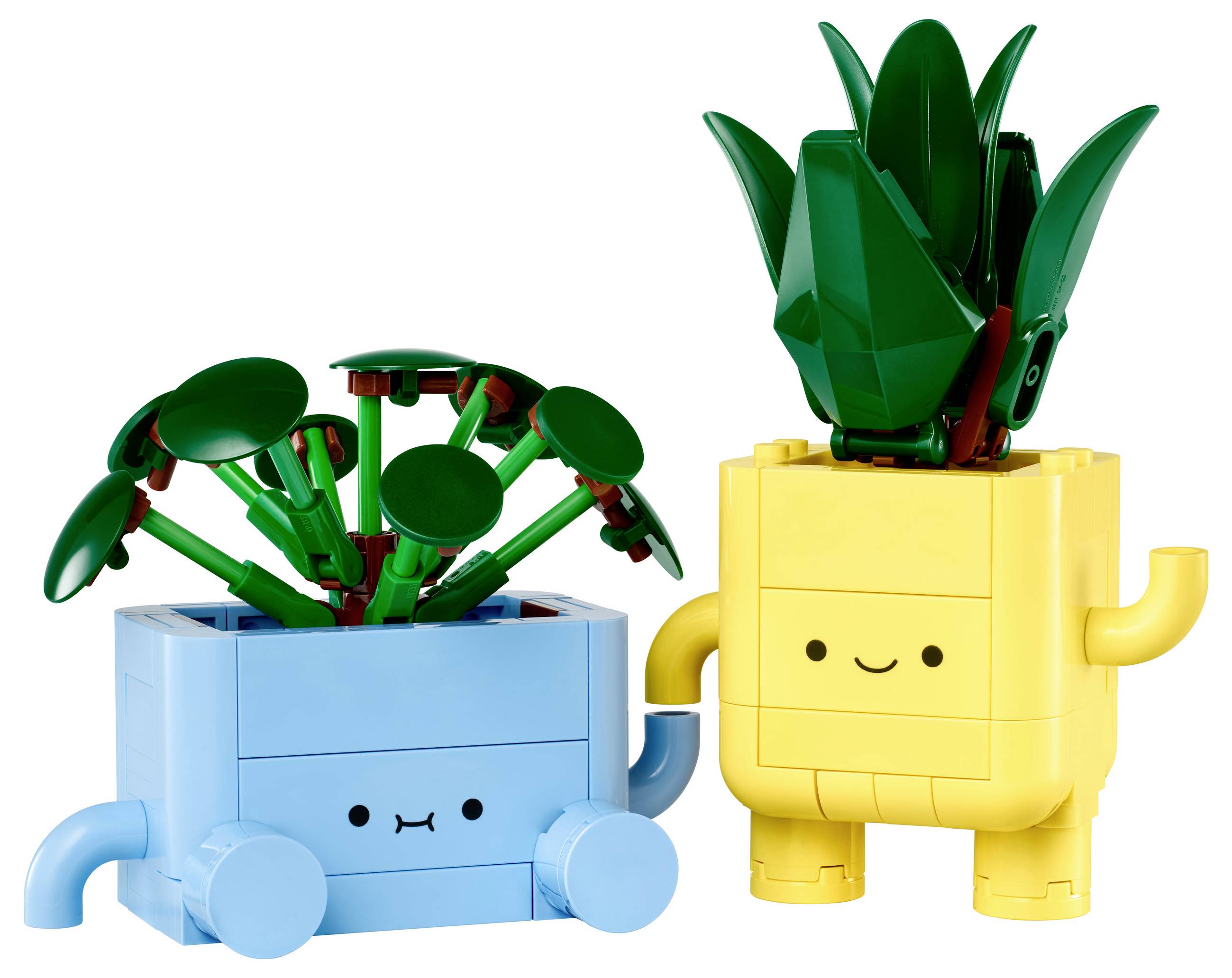 Dva LEGO kvetináče s tvárou. Ľavý kvetináč je modrý so zelenými listami, pravý žltý s vzpriameným, zeleným kaktusom. Oba sa usmievajú.