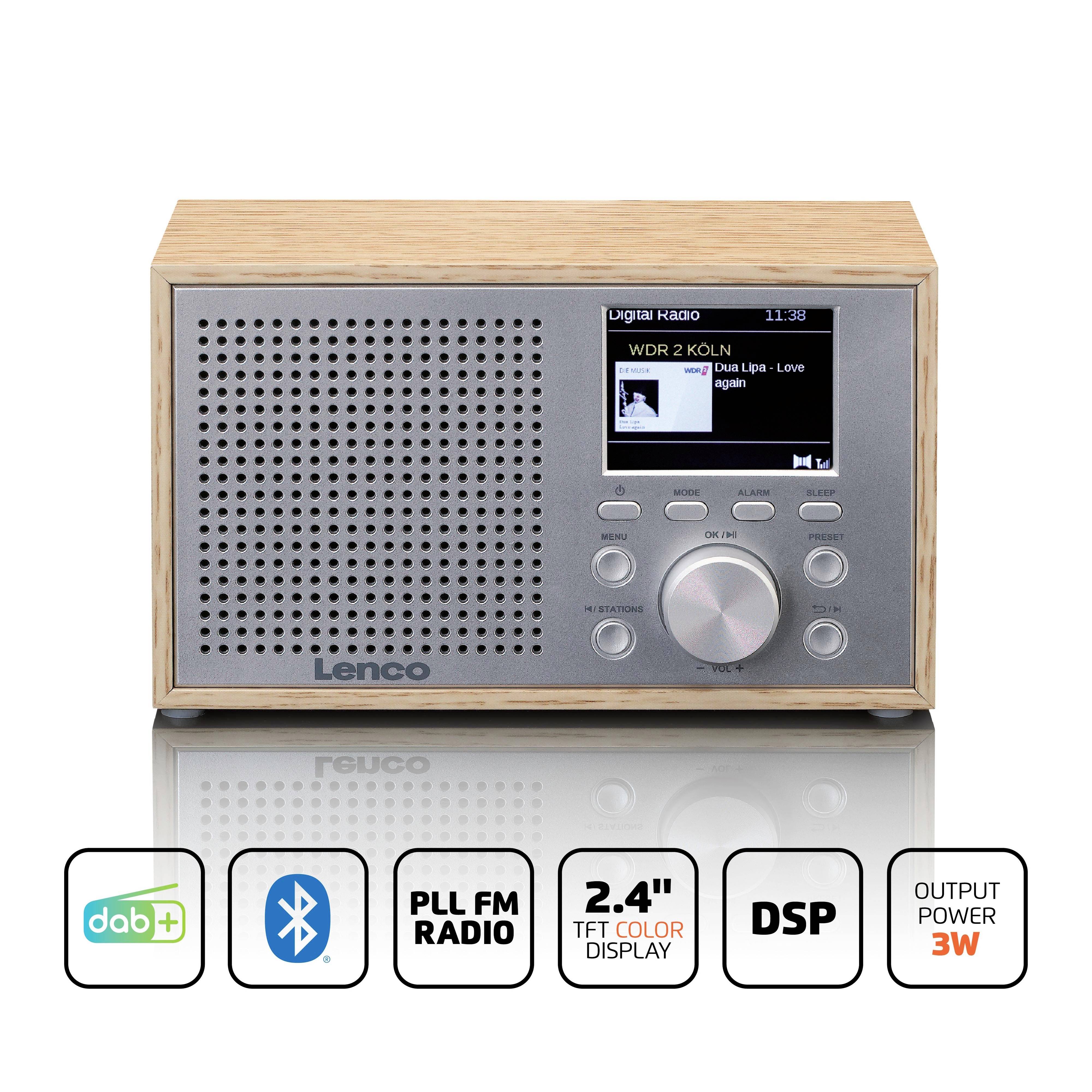 Digitálne drevené rádio s reproduktorom a displejom, zobrazuje 'WDR 2 Köln - Dua Lipa: Love Again', podporuje DAB, Bluetooth a ďalšie funkcie.