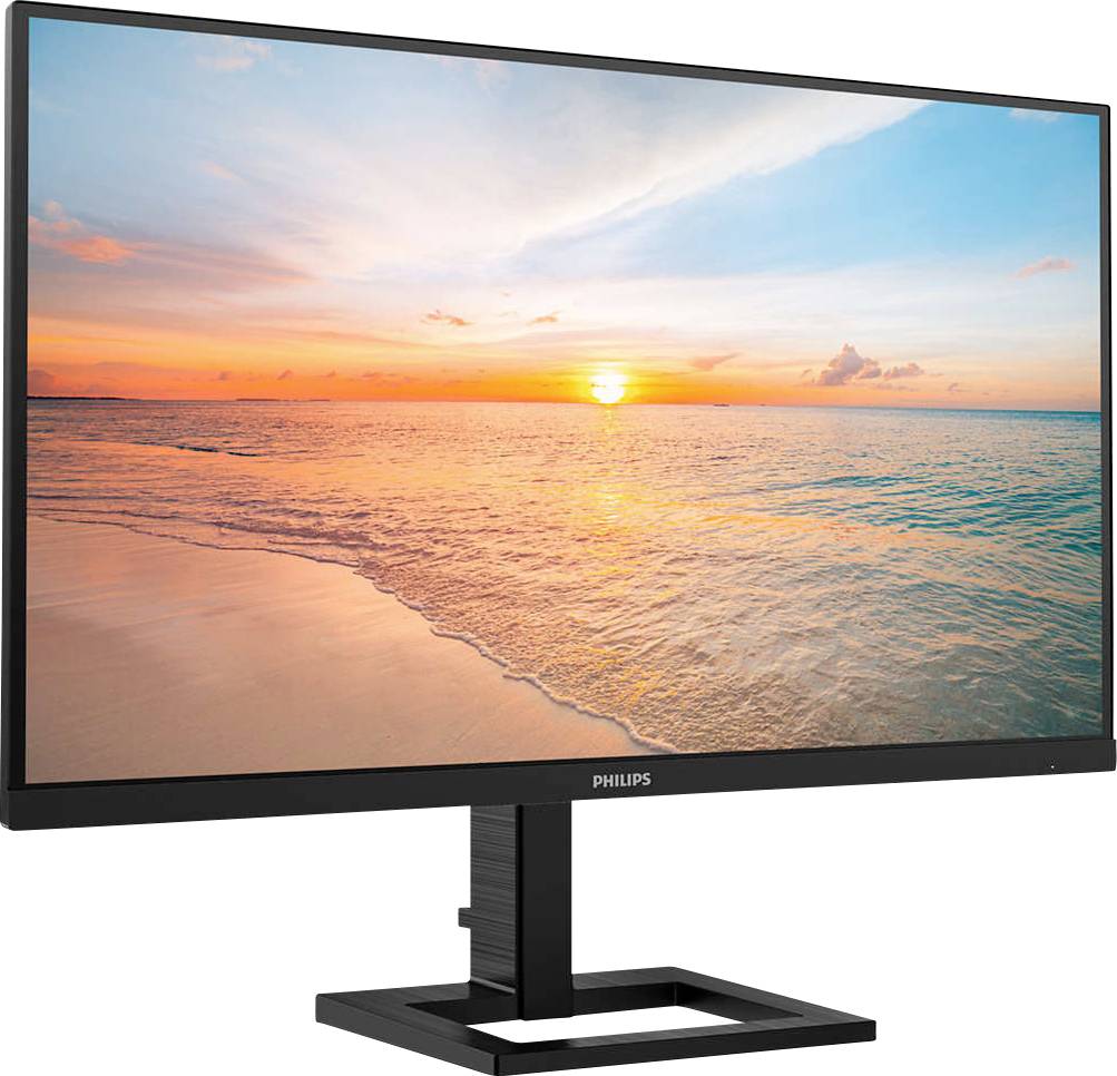 Monitor s pozadím západ slnka na pláži; zobrazuje more a oblohu v teplých farebných tónoch.