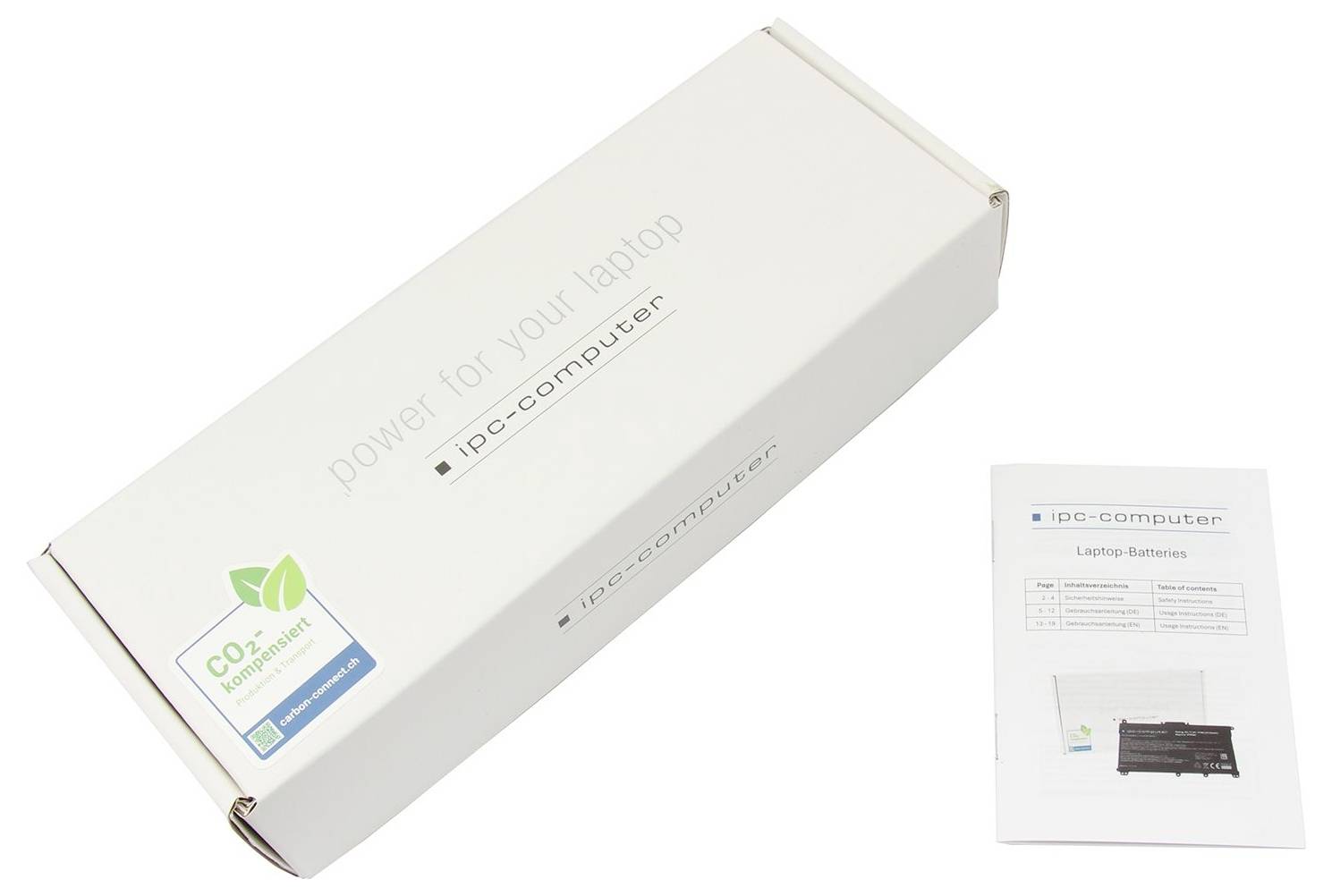 Podlhovastý, biely obal s nápisom 'power for your laptop' a príbalový leták k batérii notebooku s informáciami od výrobcu.
