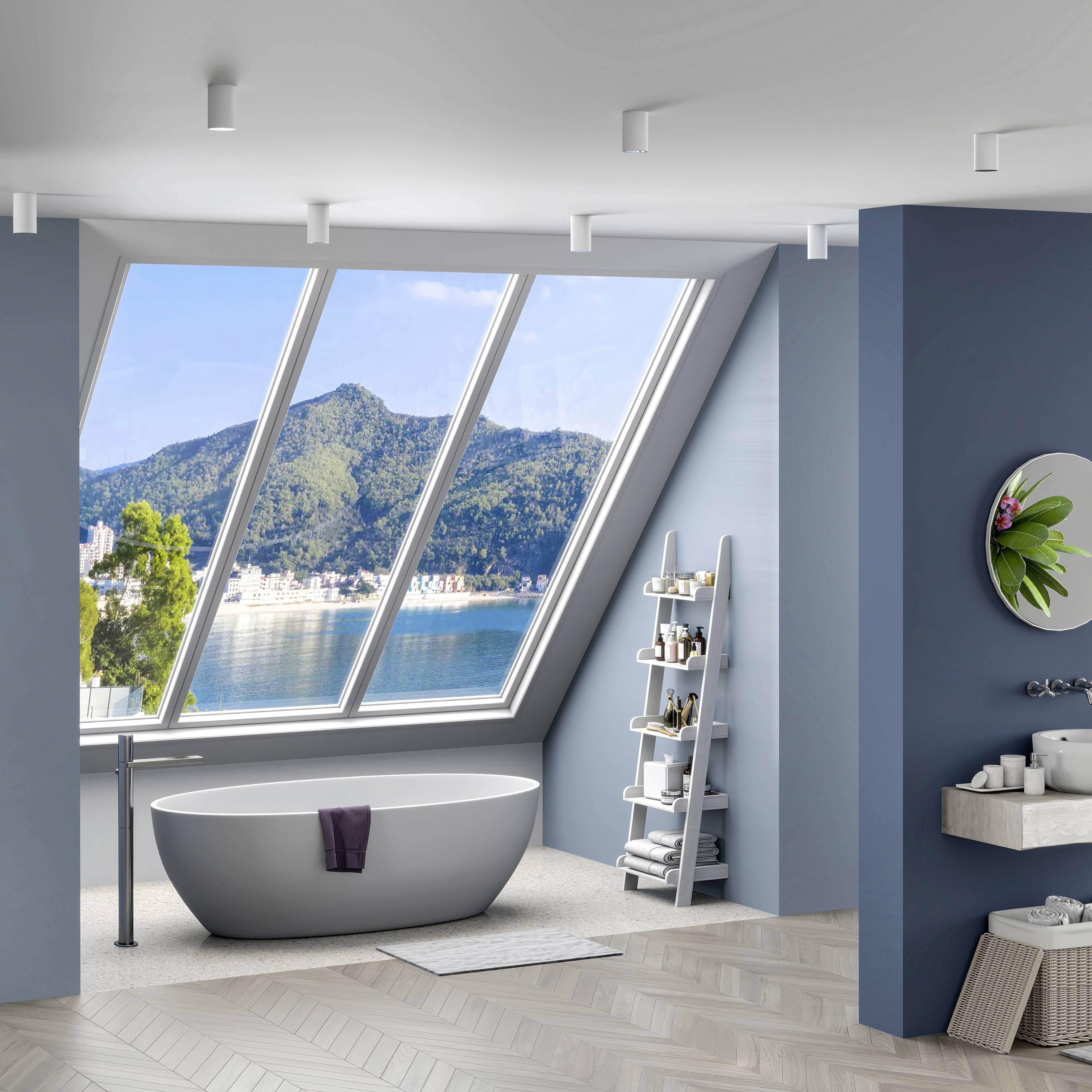 Moderná kúpeľňa so samostatne stojacou vaňou pred šikmým oknom, s výhľadom na hory a jazero, elegantná polica, uteráky, rastliny.