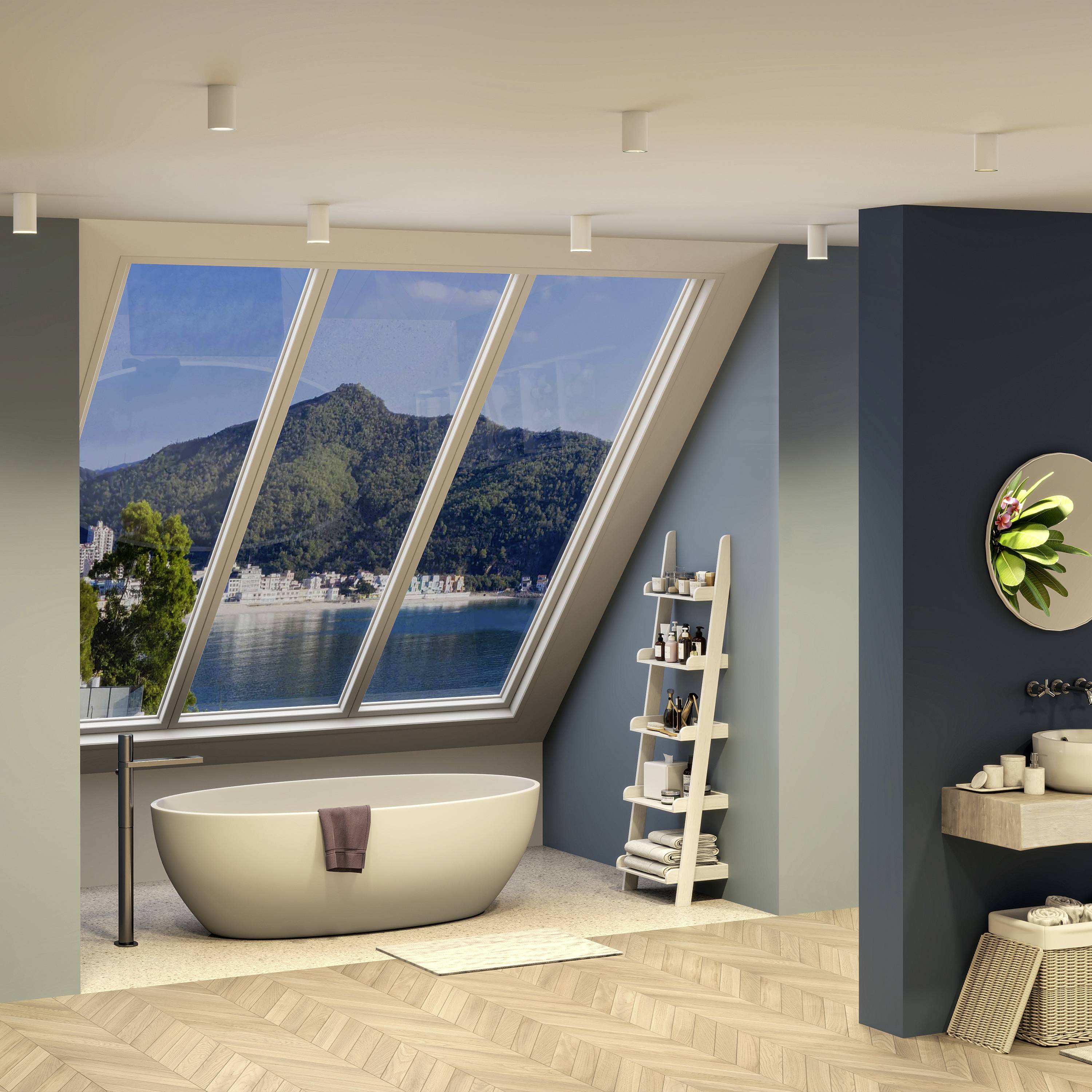 Moderná vaňa v miestnosti s veľkými oknami, ktoré ponúkajú výhľad na krajinu a more. Uterák leží na okraji vane.