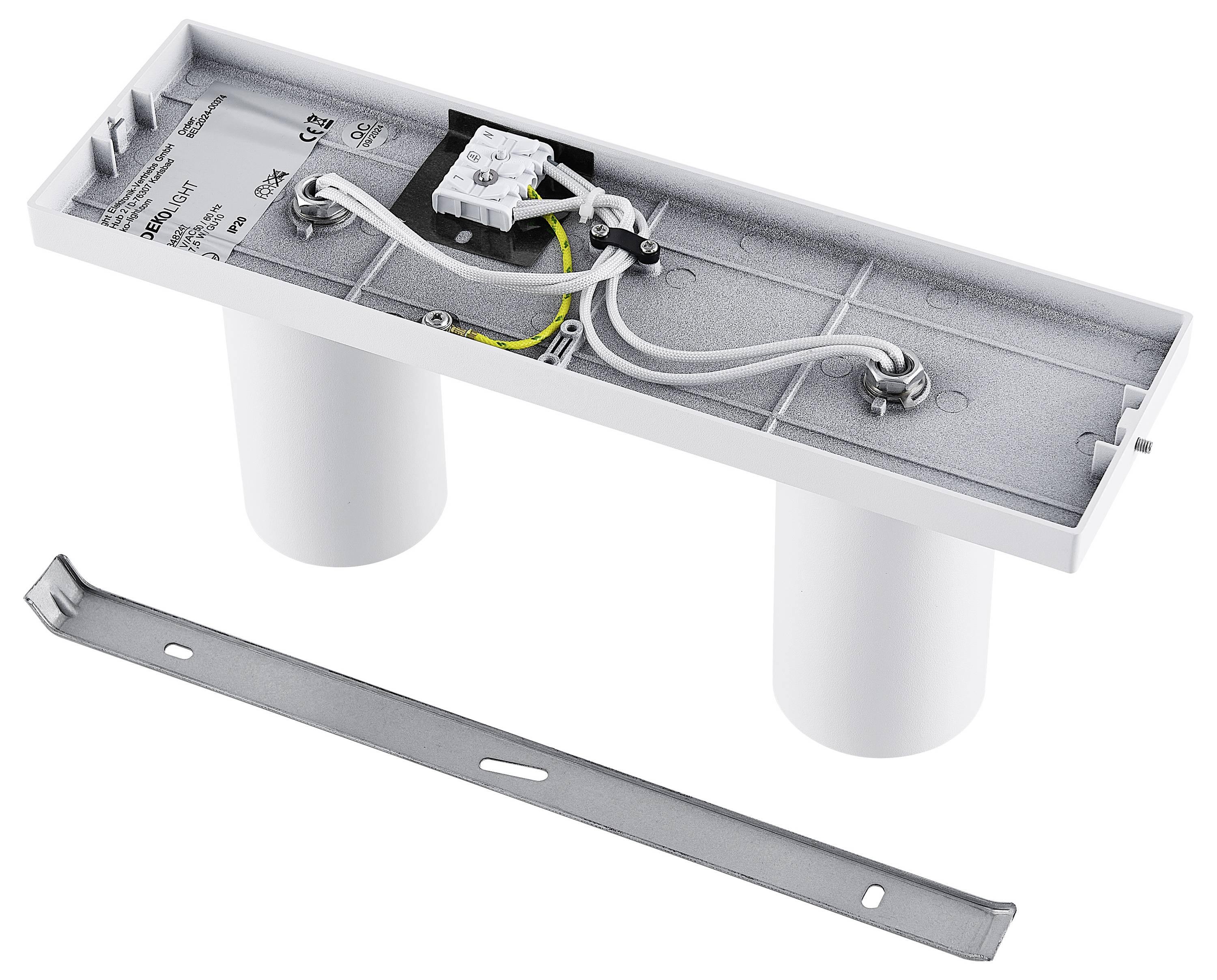 Obdĺžnikový elektronický nosič súčiastok s káblami a prípojkami na pripojenie k vodivým vedeniam, vedľa ktorého sa nachádza kovový držiak.
