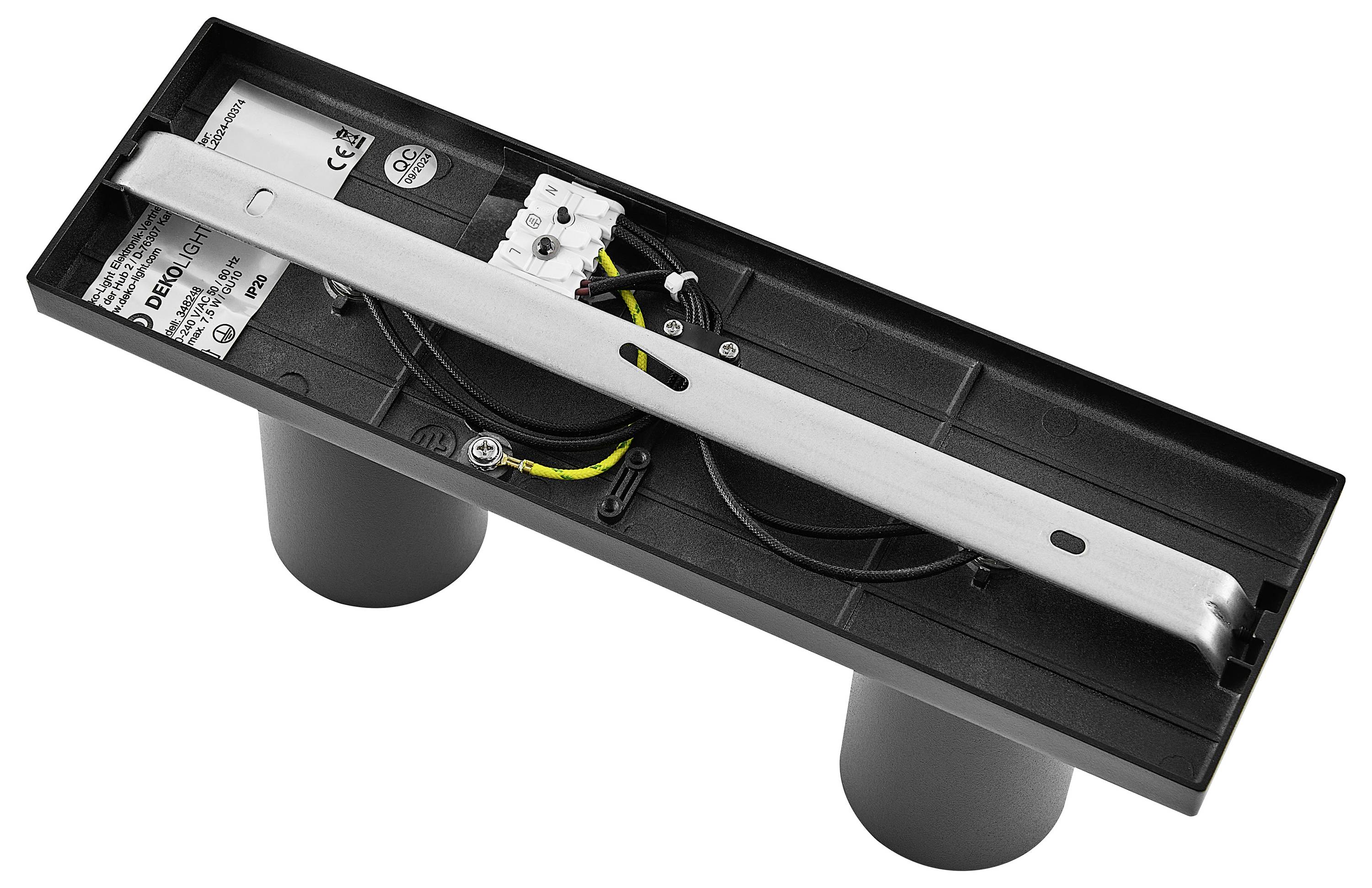 Obdĺžnikové technické zariadenie s dvoma okrúhlymi stojanmi, viditeľnými káblami a elektronickými komponentmi na čiernej základni.