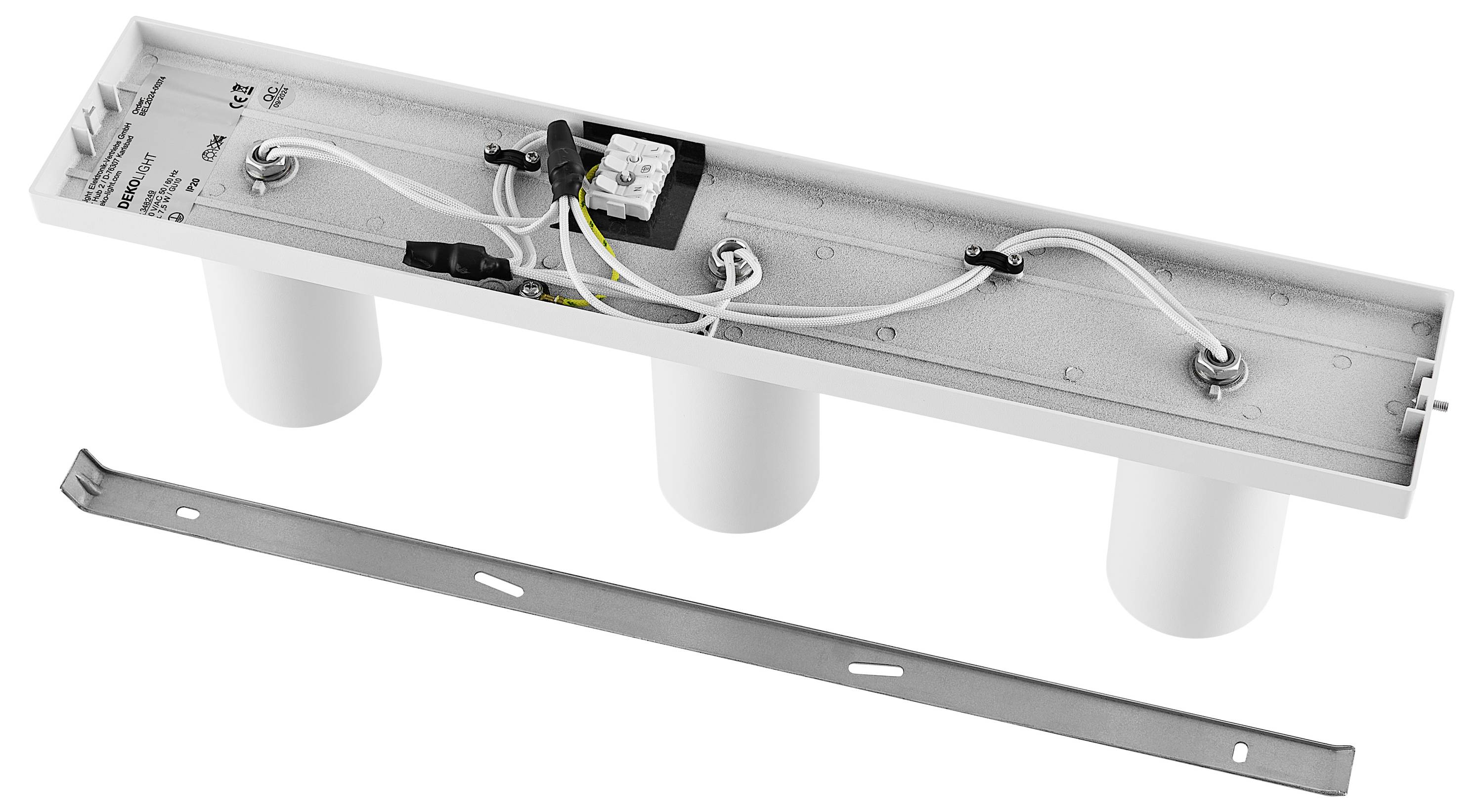 Obdĺžnikový kryt so tromi integrovanými valcovitými nádobami a voľne prístupnými elektrickými káblami na hornej strane.