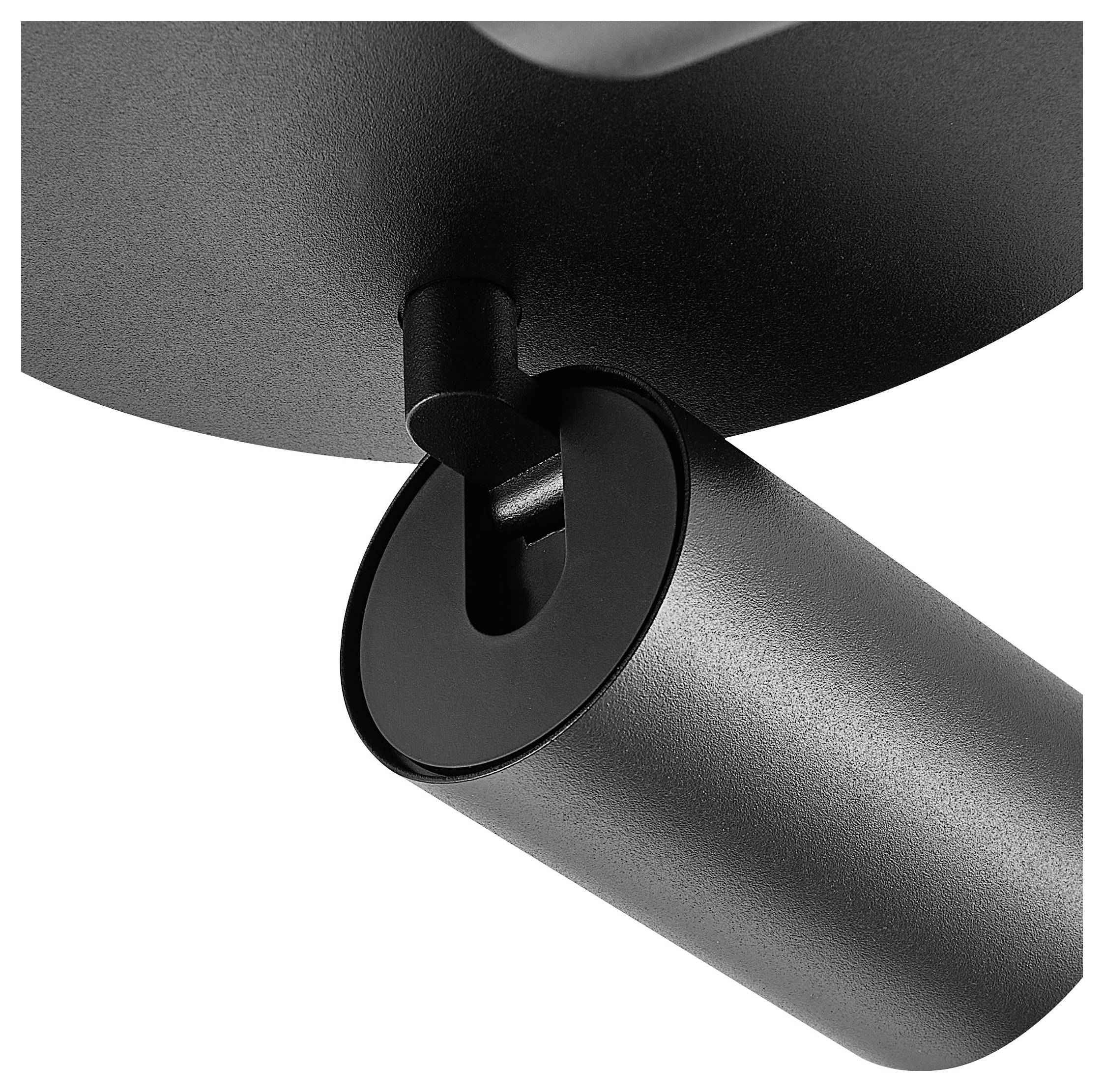 Detailný záber modernej, čiernej stropnej lampy s valcovitým dizajnom a nastaviteľnou hlavou, vhodnej pre smerované svetlo.