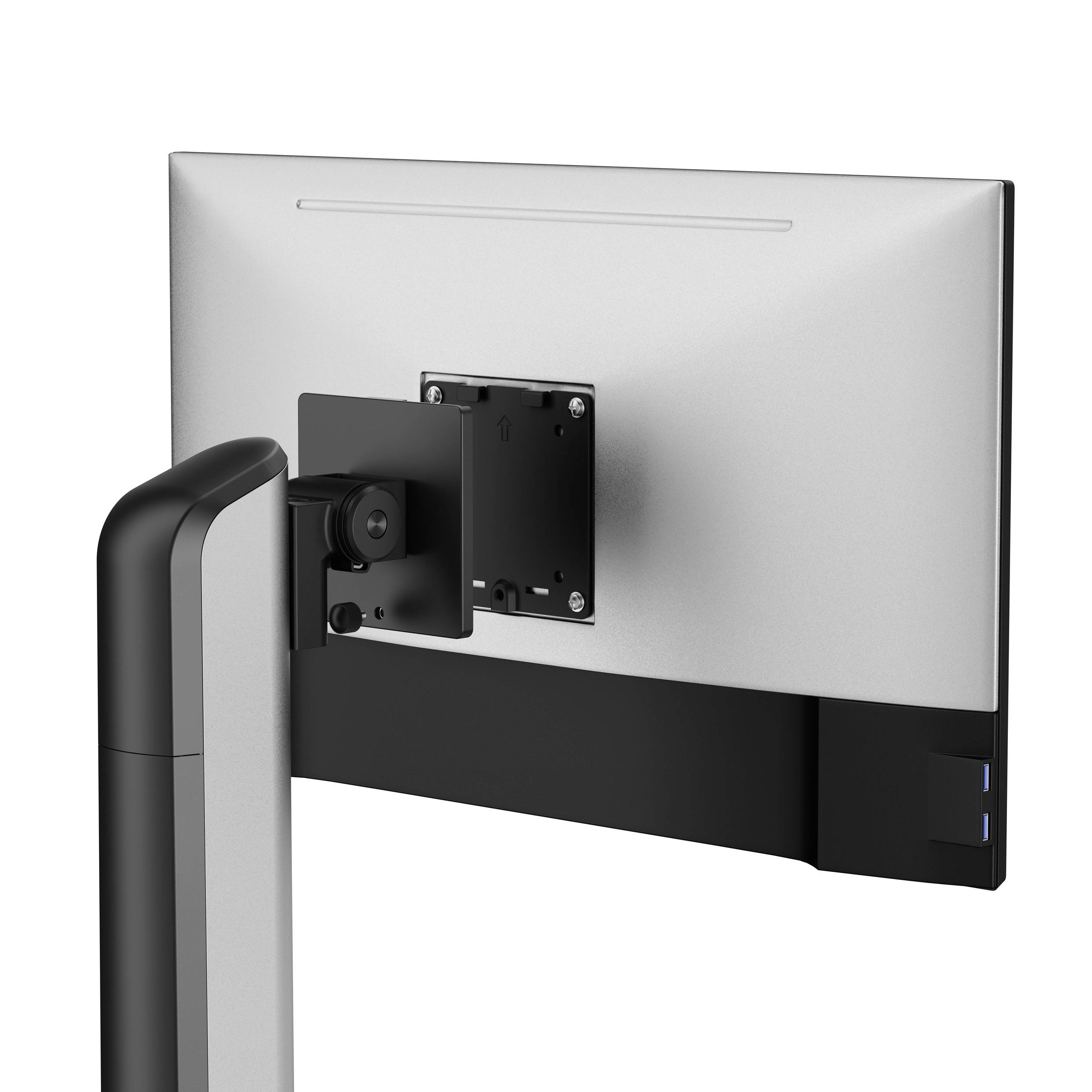 Monitor bez podstavca je zobrazený zozadu, pričom sú zvýraznené montážne body VESA a pripojenie otočného ramena.