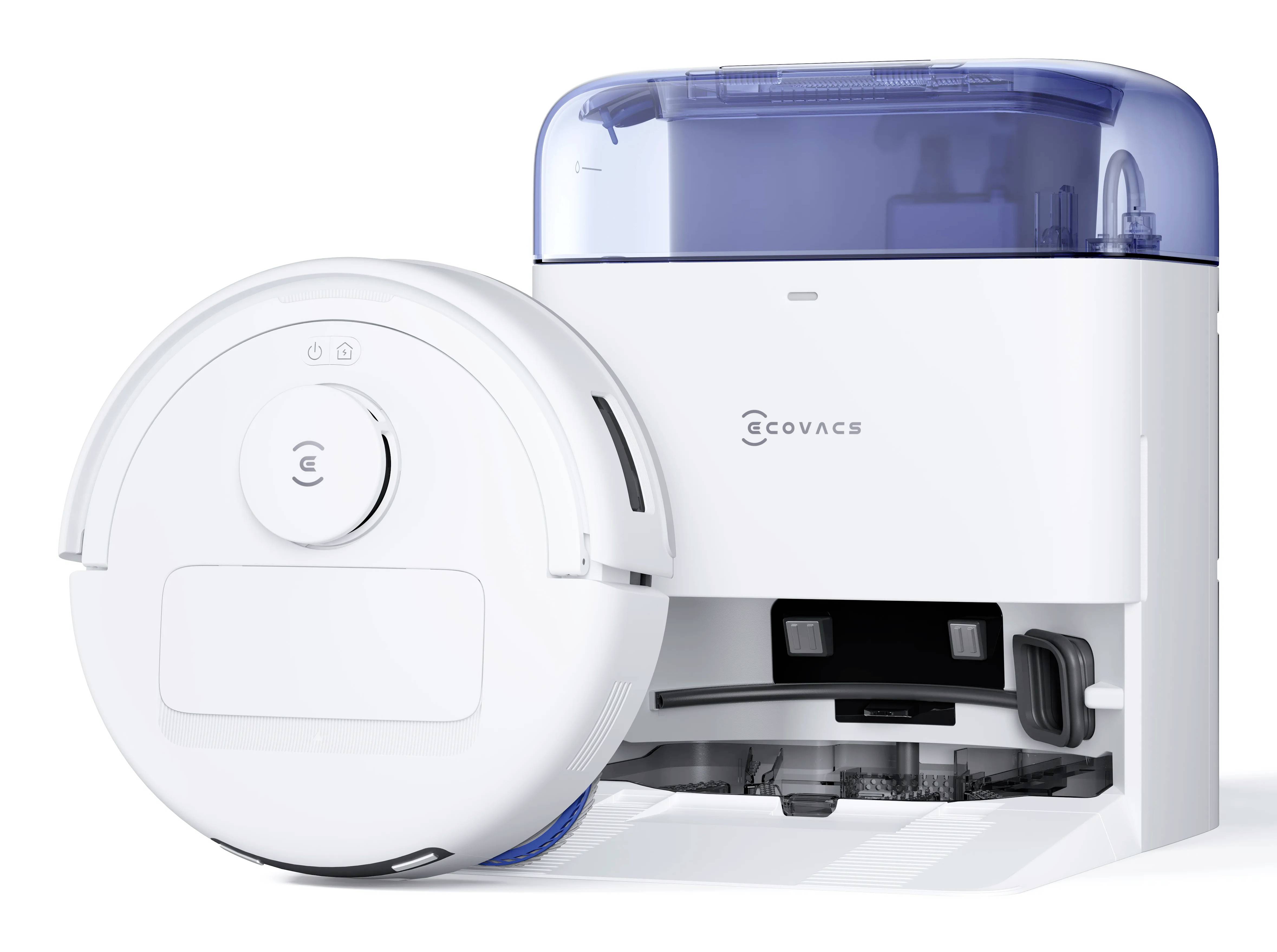 Biely robotický vysávač vedľa svojej dokovacej stanice. Vysávač je navrhnutý na automatizované čistenie podláh a vyznačuje sa elegantným, moderným dizajnom.