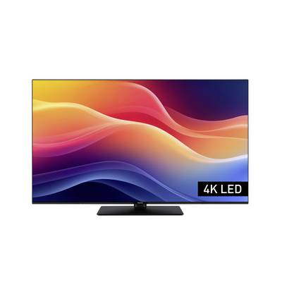 Plochá TV zobrazujúca živý abstraktný vlnový vzor v červenej, oranžovej a modrej farbe, s nápisom '4K LED' v pravom dolnom rohu.