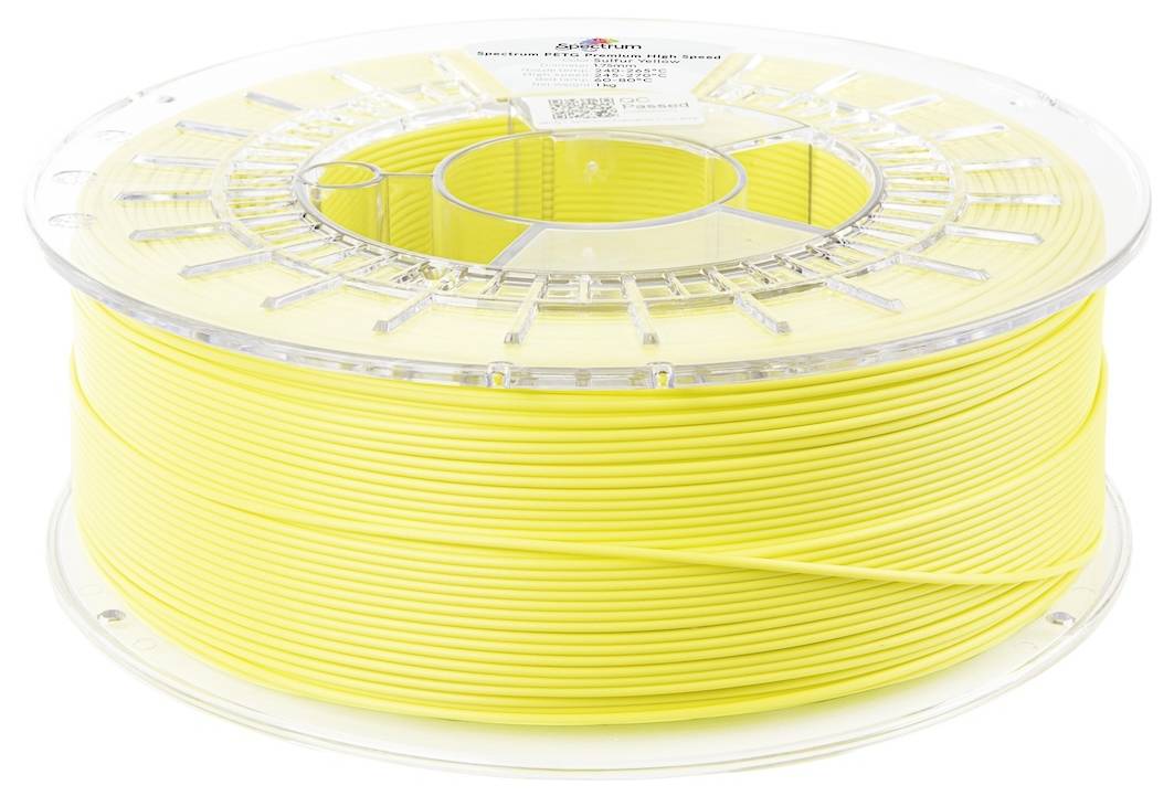 Žltá cievka 3D tlačového filamentu na priehľadnej plastovej špulke, pohľad z boku, s produktovou etiketou na vrchu.