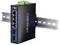 Čierny a modrý priemyselný ethernetový prepínač TRENDnet namontovaný na kovovej koľajnici. Disponuje piatimi sieťovými portmi a zeleným napájacím konektorom na vrchu.
