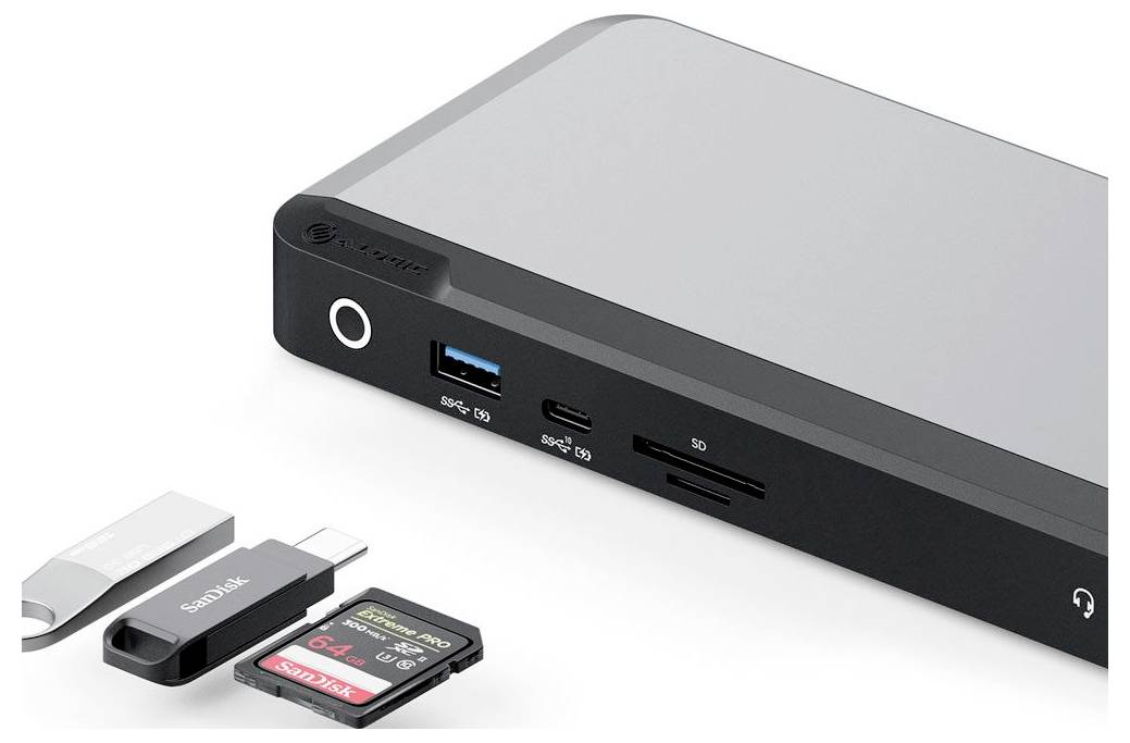 Zariadenie s rôznymi portami vrátane USB, slotov na SD kartu a microSD. V blízkosti sú USB a SD karty, čo naznačuje schopnosť prenosu dát.