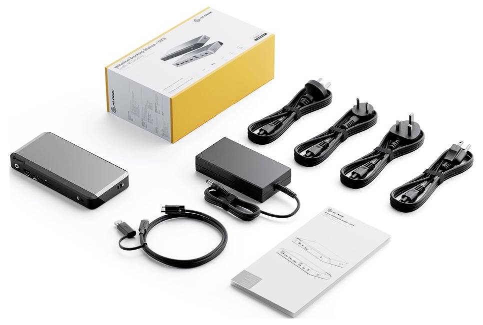 Dokovacia stanica obsahuje zariadenie, napájací adaptér, viacero typov zástrčiek, USB kábel a manuál, všetko v značkovej krabici.