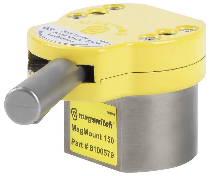 Žltý magnetický držiak MagMount 150 s pákou a štítkom s nápisom 'Part # 8100579', používaný na upevňovanie predmetov na mieste.