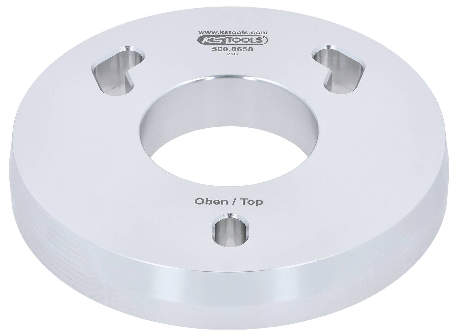 Kruhový kovový disk s centrálnym otvorom, označený nápisom 'Oben/Top'. Gravírovaný nápisom 'KS TOOLS' a modelom '500.8658'.