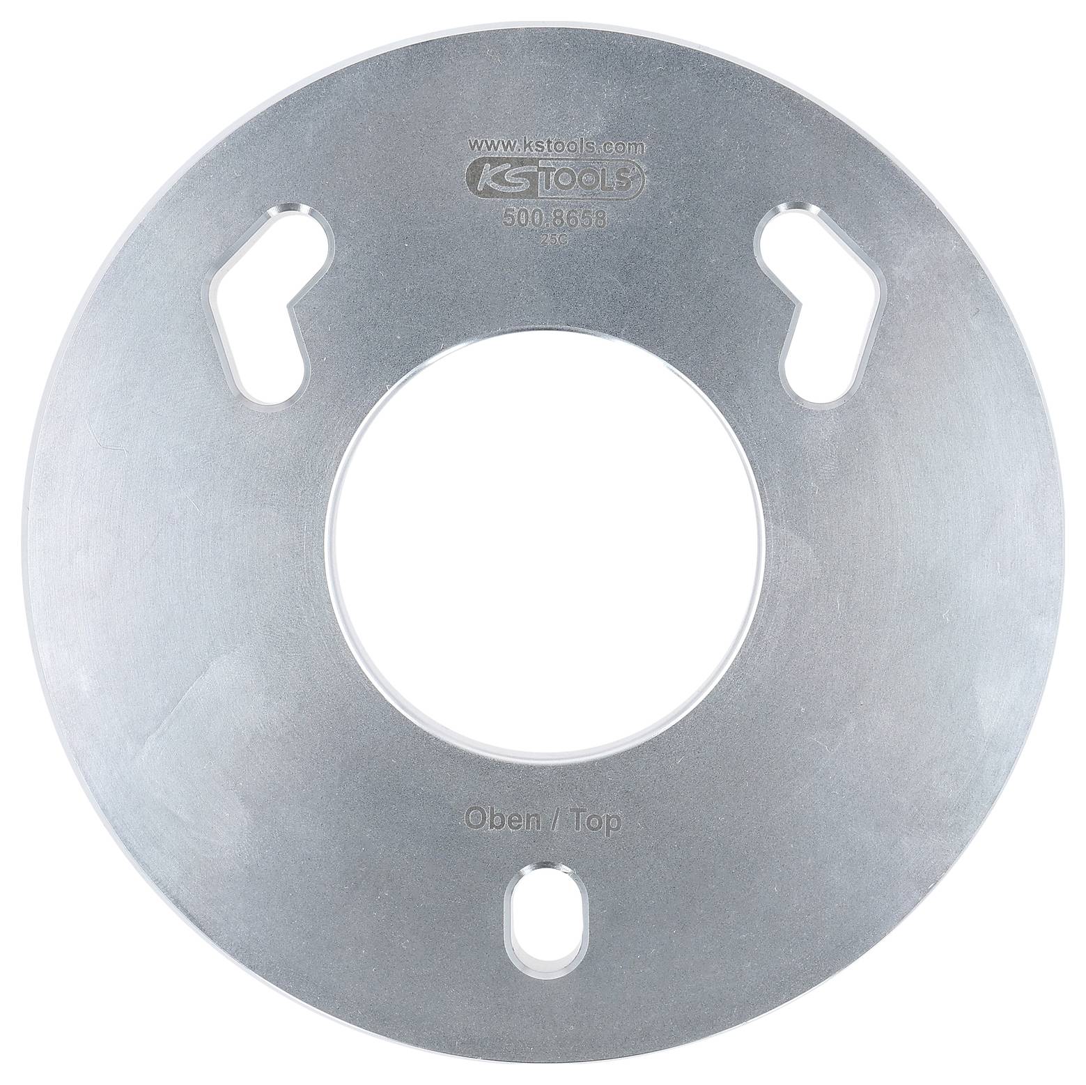 Strieborný kovový disk s troma otvormi pre kľúč, označený 'KS TOOLS', centrálne vyrazené '500.8668', s označením 'Hore / Top' v spodnej časti.