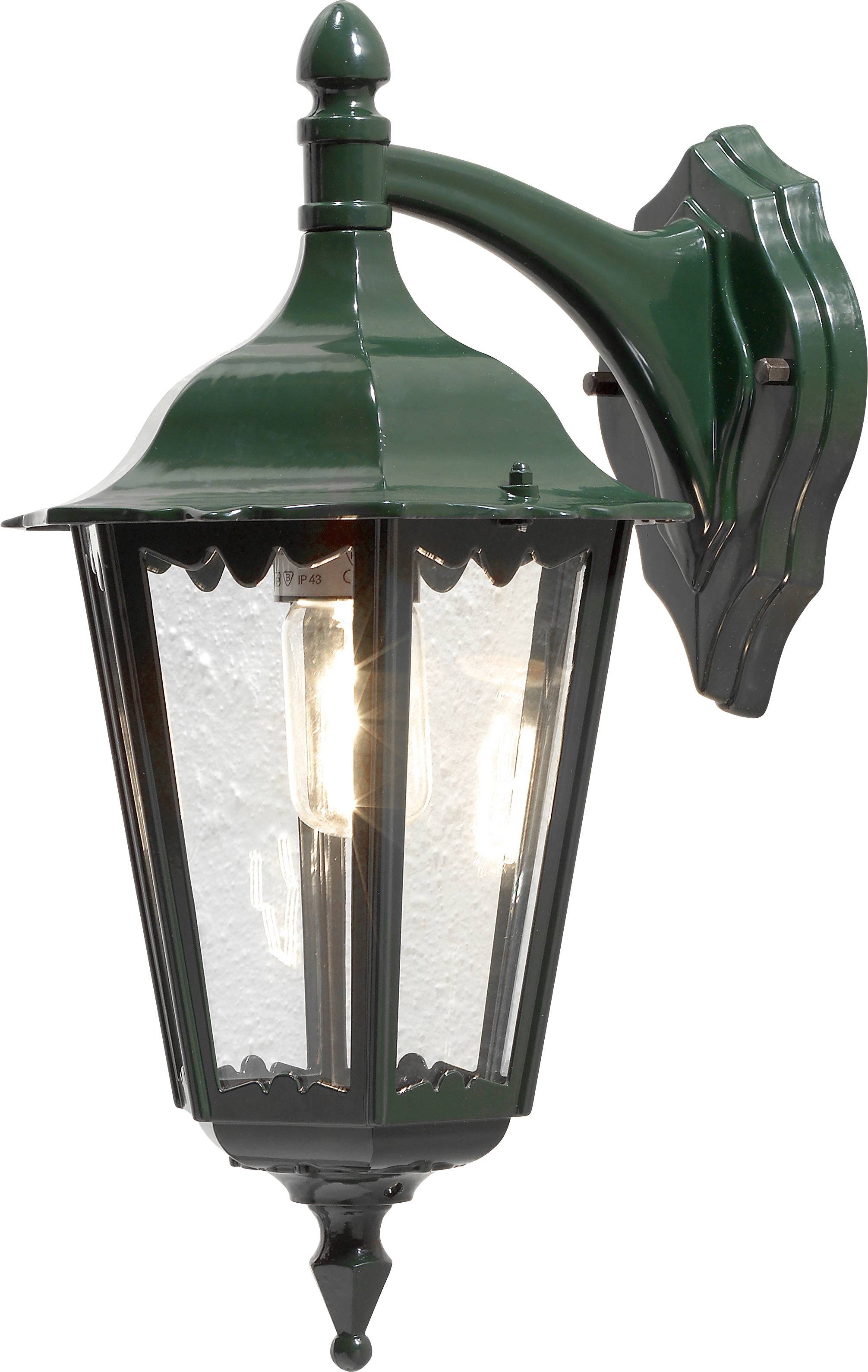 Vonkajšia nástenná lampa s zeleným kovovým rámom a priesvitnými sklenenými tabuľami, osvetľujúca sa zo singulárnej viditeľnej žiarovky vo vnútri.