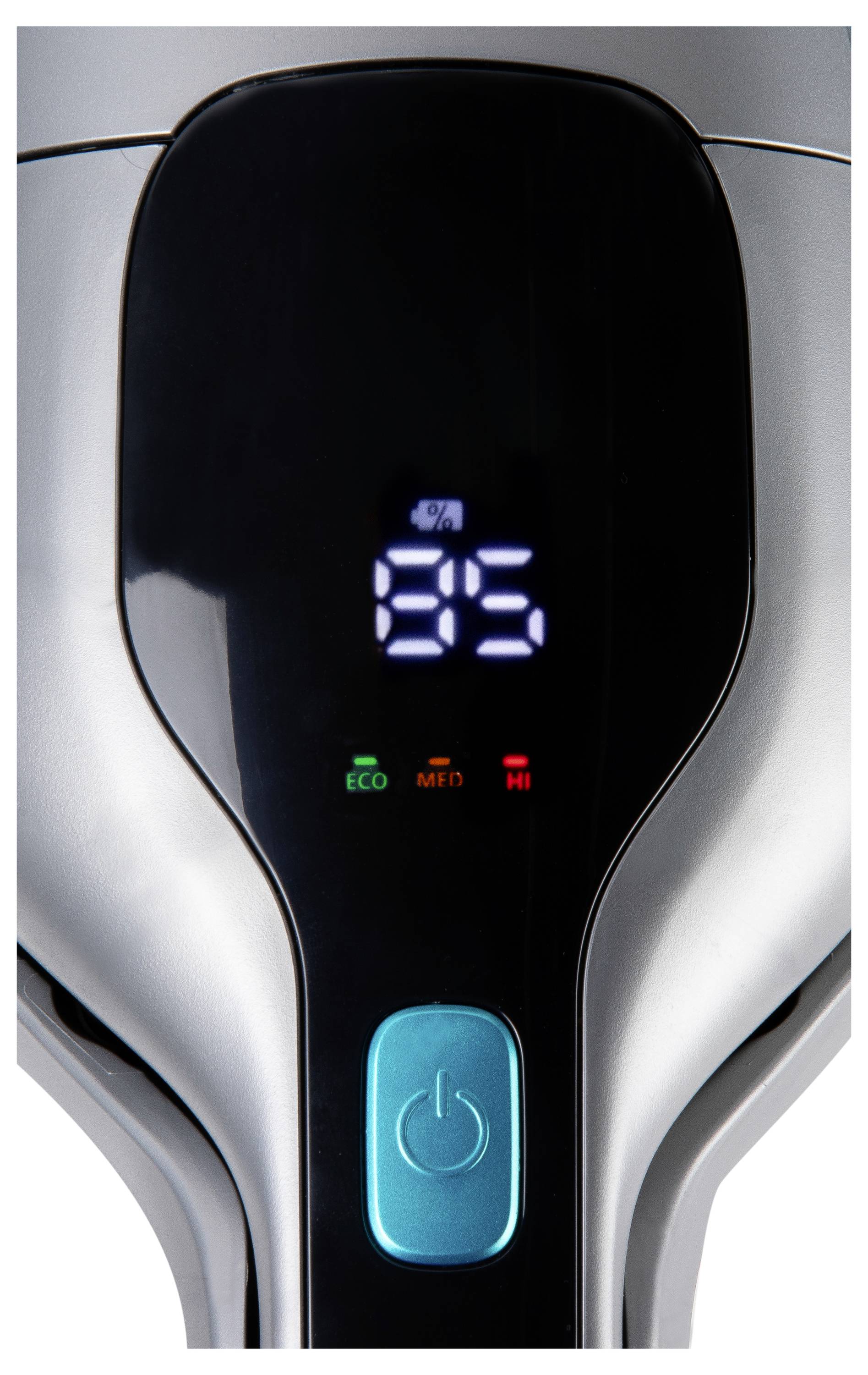 Digitálny displej zobrazujúci '85%', s tromi indikačnými svetlami označenými 'ECO', 'MED' a 'HI' nad modrasto-zeleným (tyrkysovým) napájacím tlačidlom na striebornom zariadení.