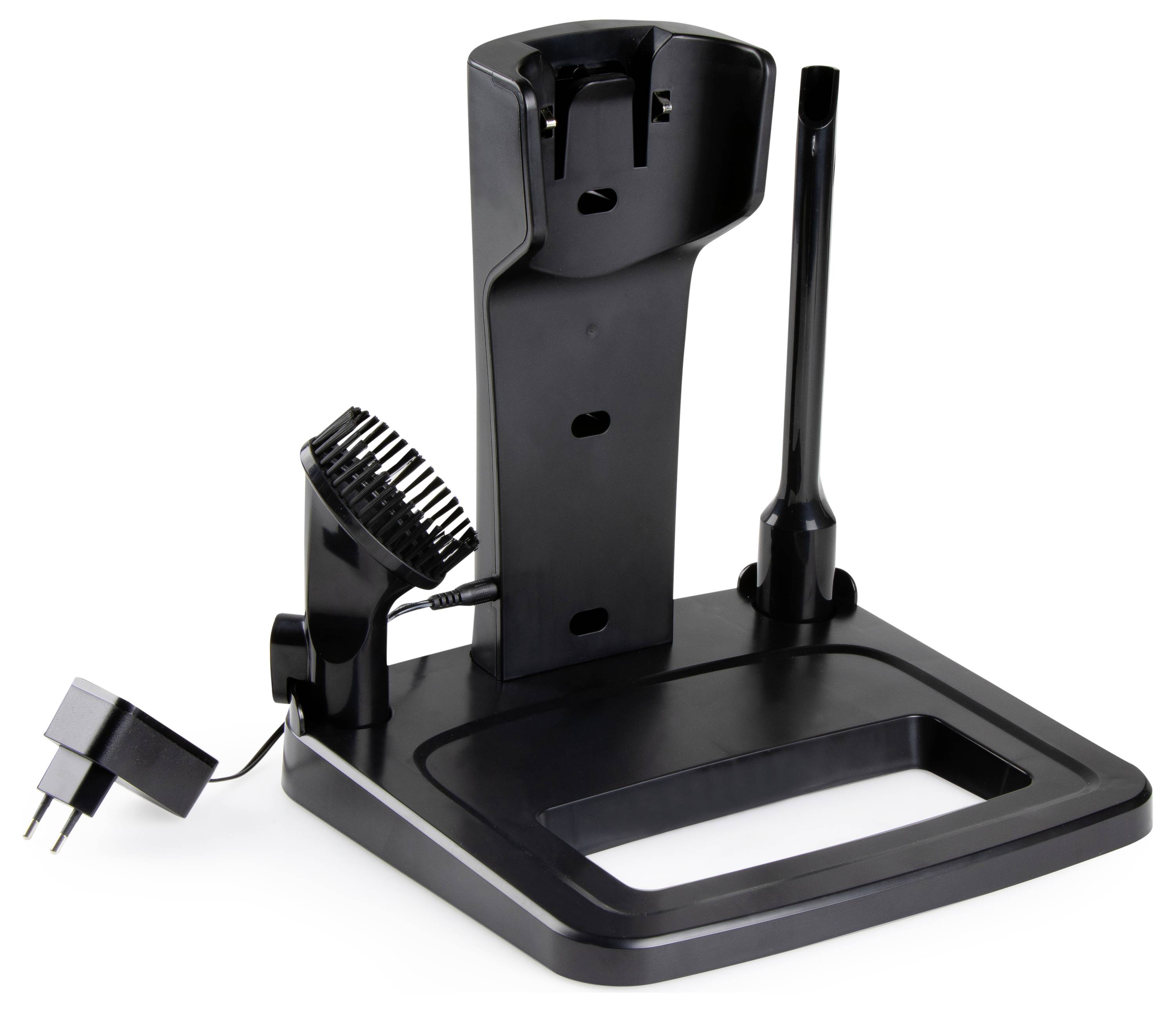 Stojan na čierne zastrihávače s nabíjacím portom a priestorom na príslušenstvo, vrátane hrebeňovej nástavby a trysky, na bielom pozadí.