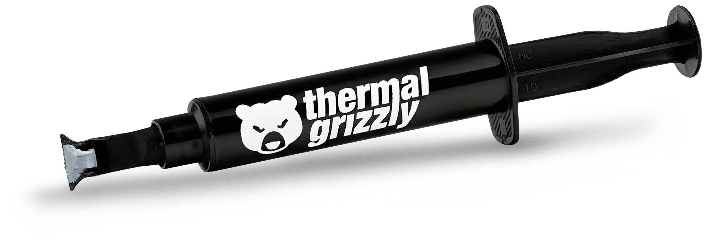 Čierna striekačka s logom 'thermal grizzly', navrhnutá na nanášanie tepelnej pasty na počítačové komponenty pre zlepšenie tepelnej vodivosti.