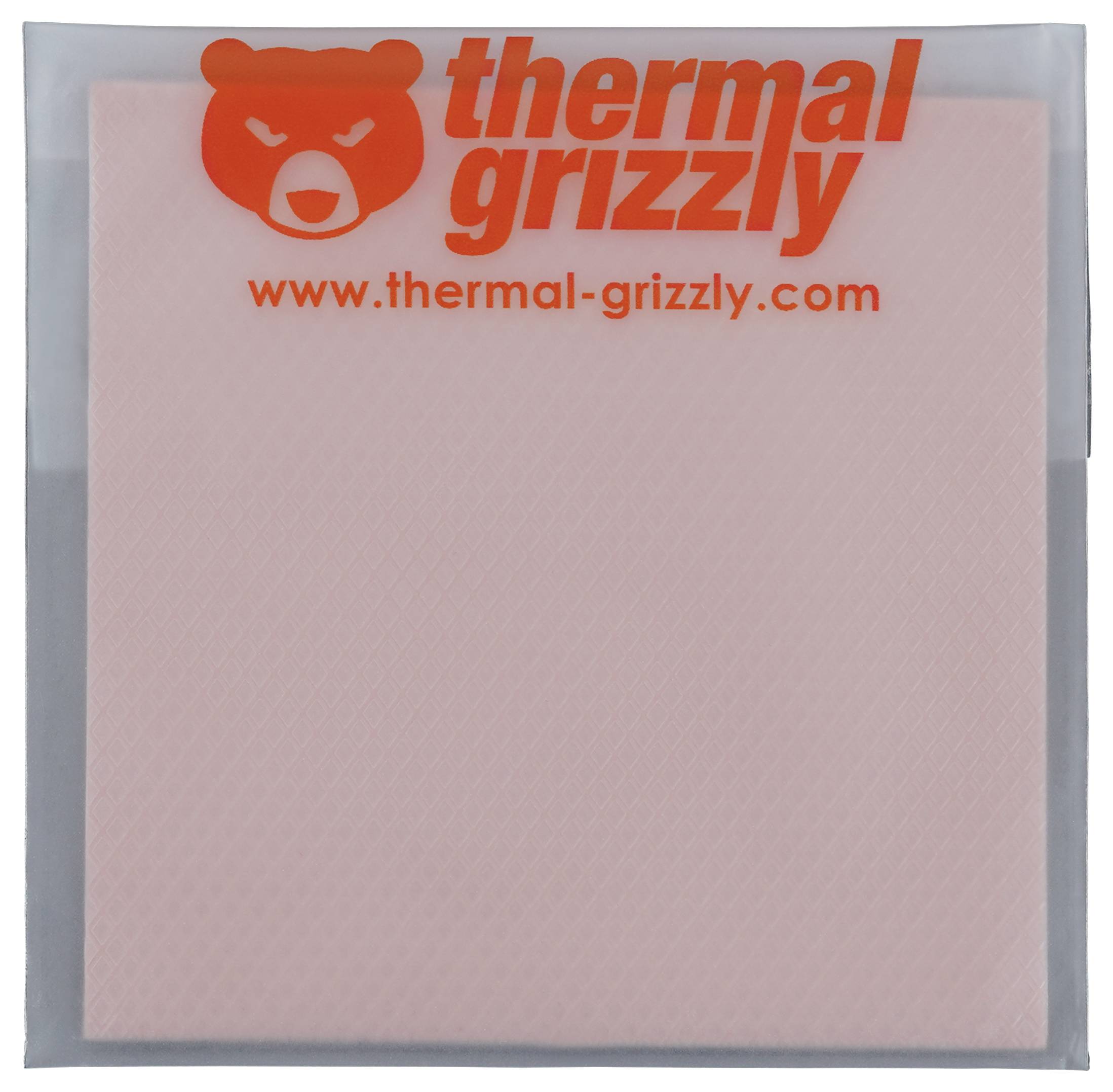 Logo 'thermal grizzly' s ikonou medveďa vytlačenou oranžovou farbou v hornej časti obalu tepelnej podložky. Na obale je viditeľná webová stránka 'www.thermal-grizzly.com'.