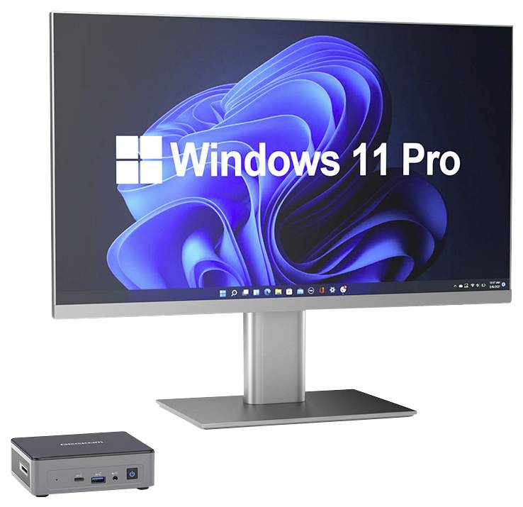 Stolný monitor zobrazujúci "Windows 11 Pro" s malým mini PC zobrazeným nižšie, čo naznačuje kompaktné nastavenie počítača Windows.