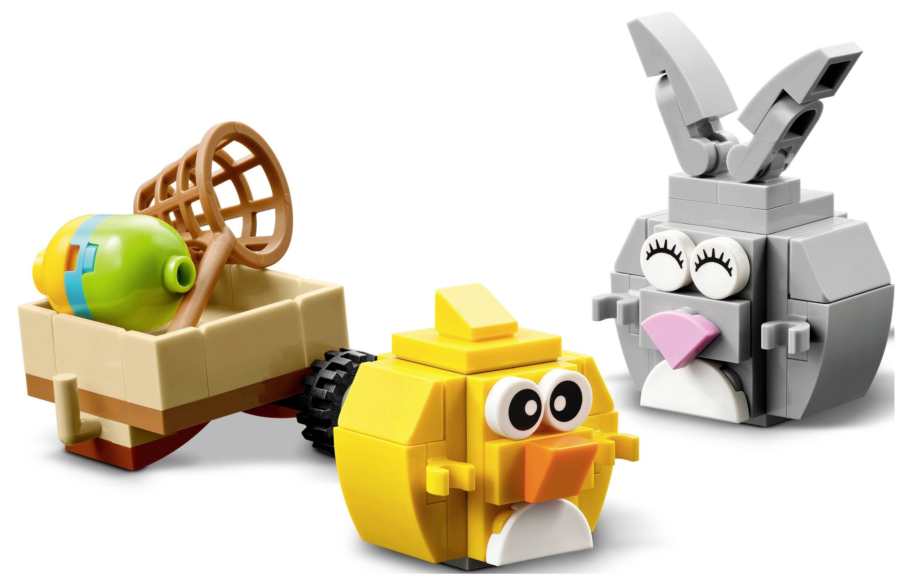 Tri veľkonočné LEGO figúrky: vozík s vajíčkom, žltý kuriatko a šedý králiček s ružovým nosom.