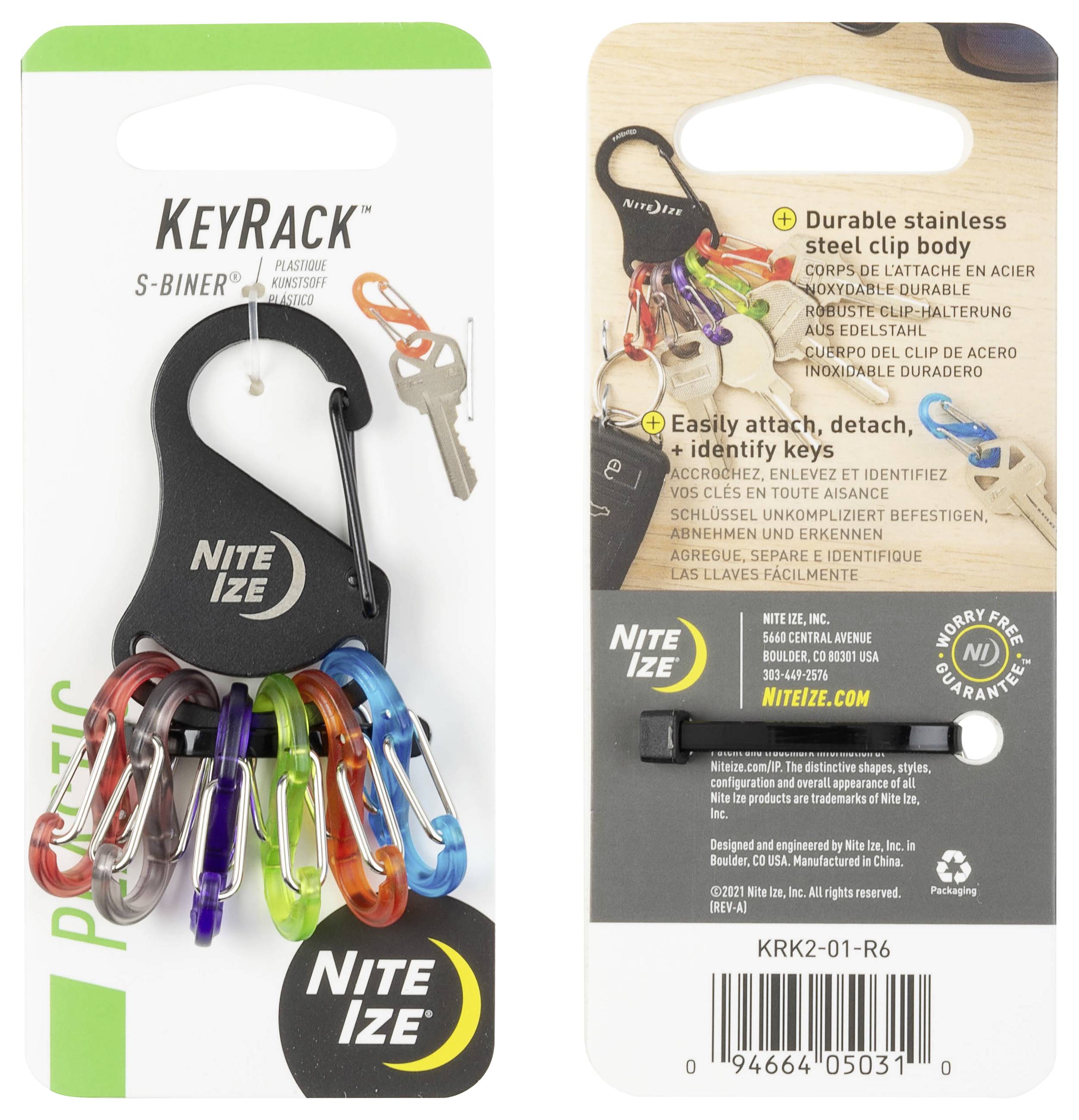 Predná strana balenia 'KeyRack S-Biner' zobrazuje šesť farebných mini S-karabínok pripevnených k čiernej karabínke. Balenie deklaruje odolnosť a jednoduché pripevnenie kľúčov.